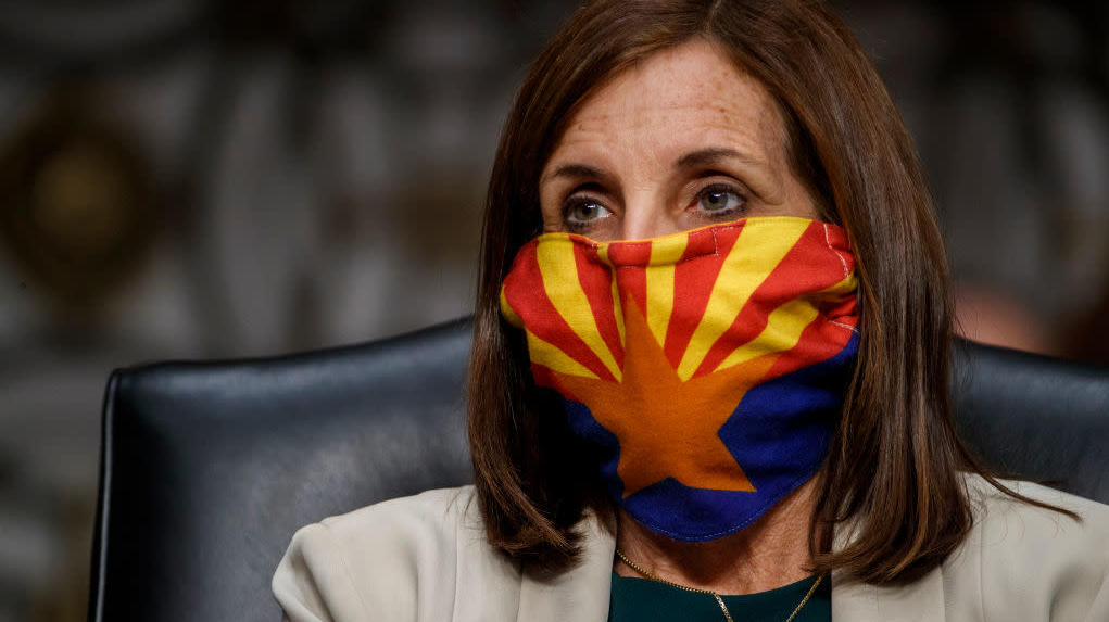 Sen. Martha McSally wears a mask depicting the Arizona state flag as she listens to testimony during the Senate Armed Services Committee hearing. (Photo: Shawn Thew - Pool, Getty Images)