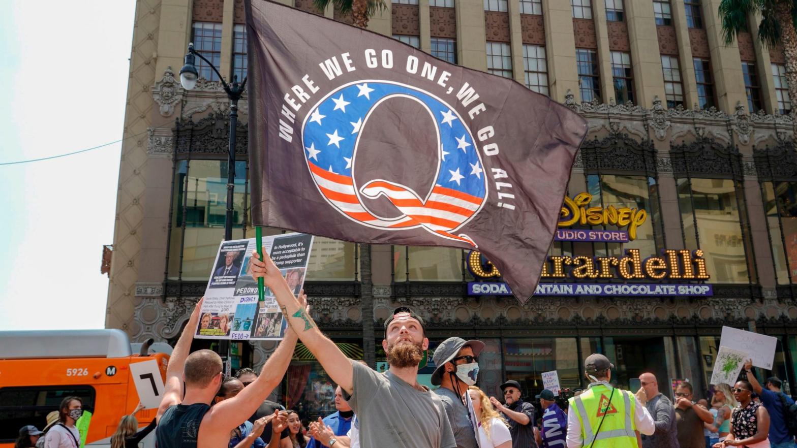 Conspiracy theorist QAnon demonstrators protest child trafficking, an issue the group has co-opted to recruit new members through hashtags like #savethechildren, on Hollywood Boulevard in Los Angeles, California, August 22, 2020.  (Photo:  Kyle Grillot, Getty Images)
