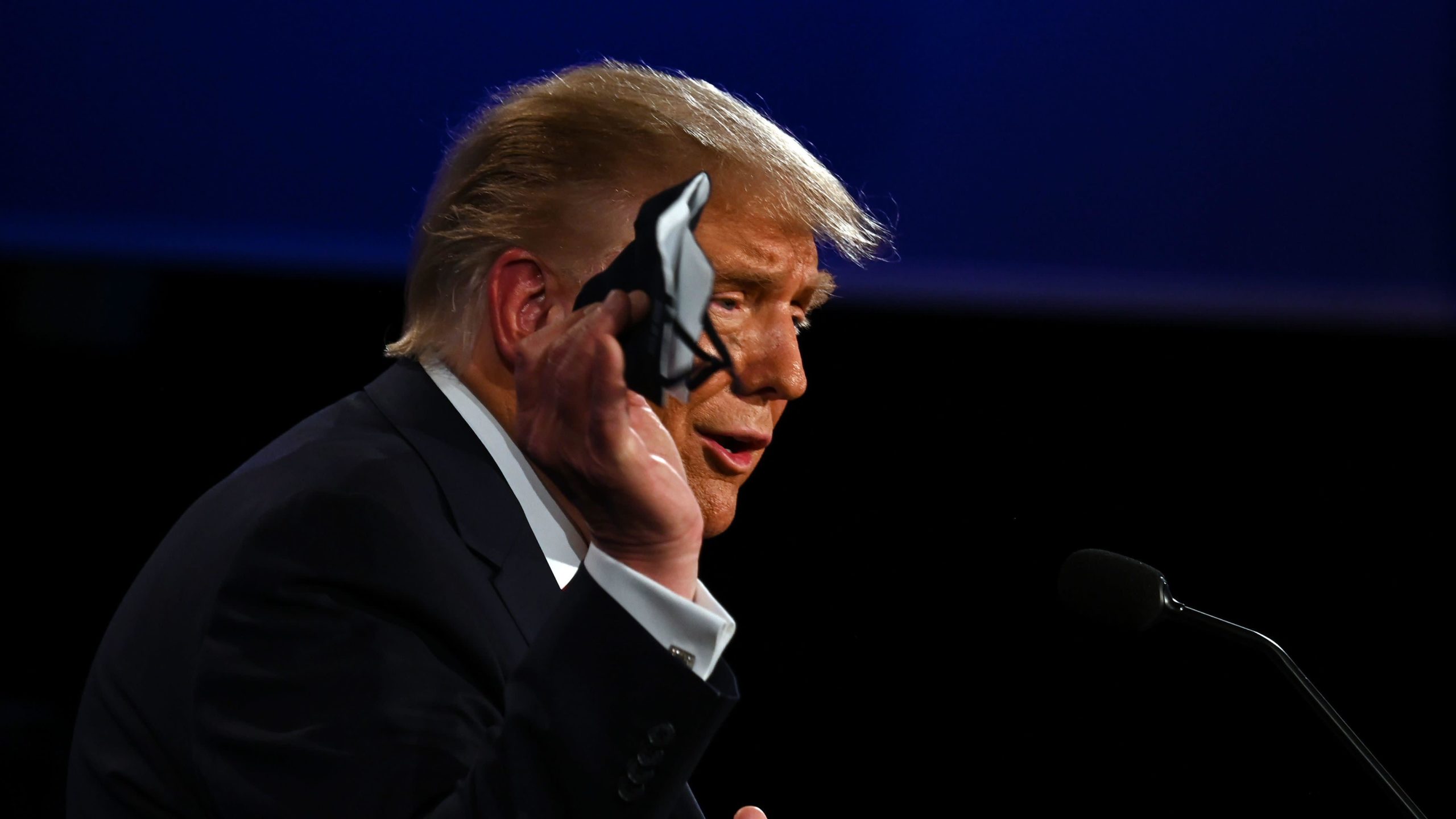 U.S. President Donald Trump holds a face mask as he speaks during the first presidential debate. (Photo: Jim Watson / AFP, Getty Images)