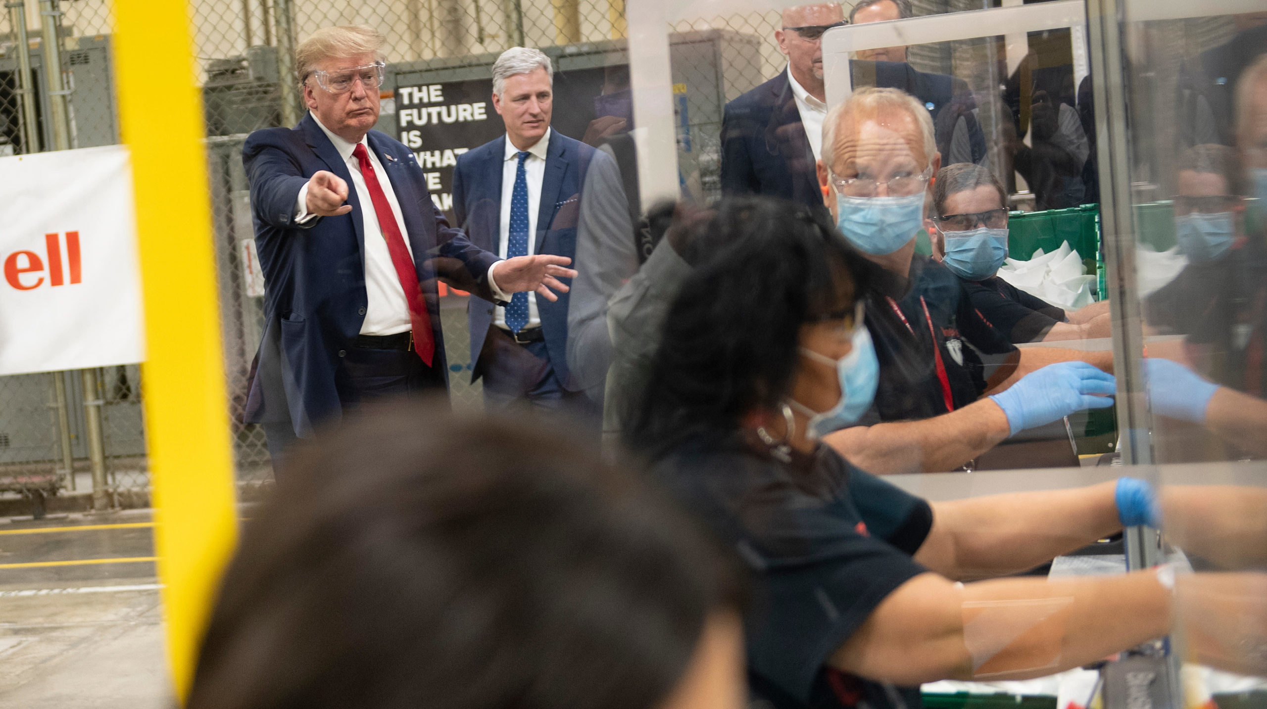 U.S. President Donald Trump tours a Honeywell International Inc. factory producing N95 masks during his first trip since widespread COVID-19 related lockdowns went into effect May 5, 2020 (Photo: Brendan Smialowski / AFP, Getty Images)