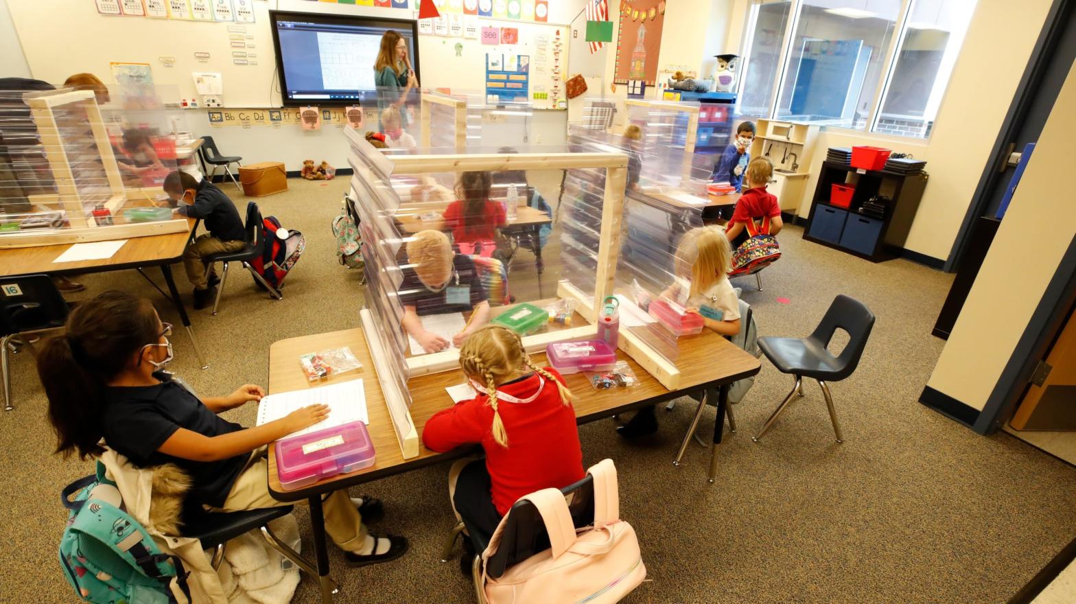 Kindergarten students work behind shields at their table at Freedom Preparatory Academy on September 10, 2020 in Provo, Utah. (Photo: GEORGE FREY/AFP, Getty Images)