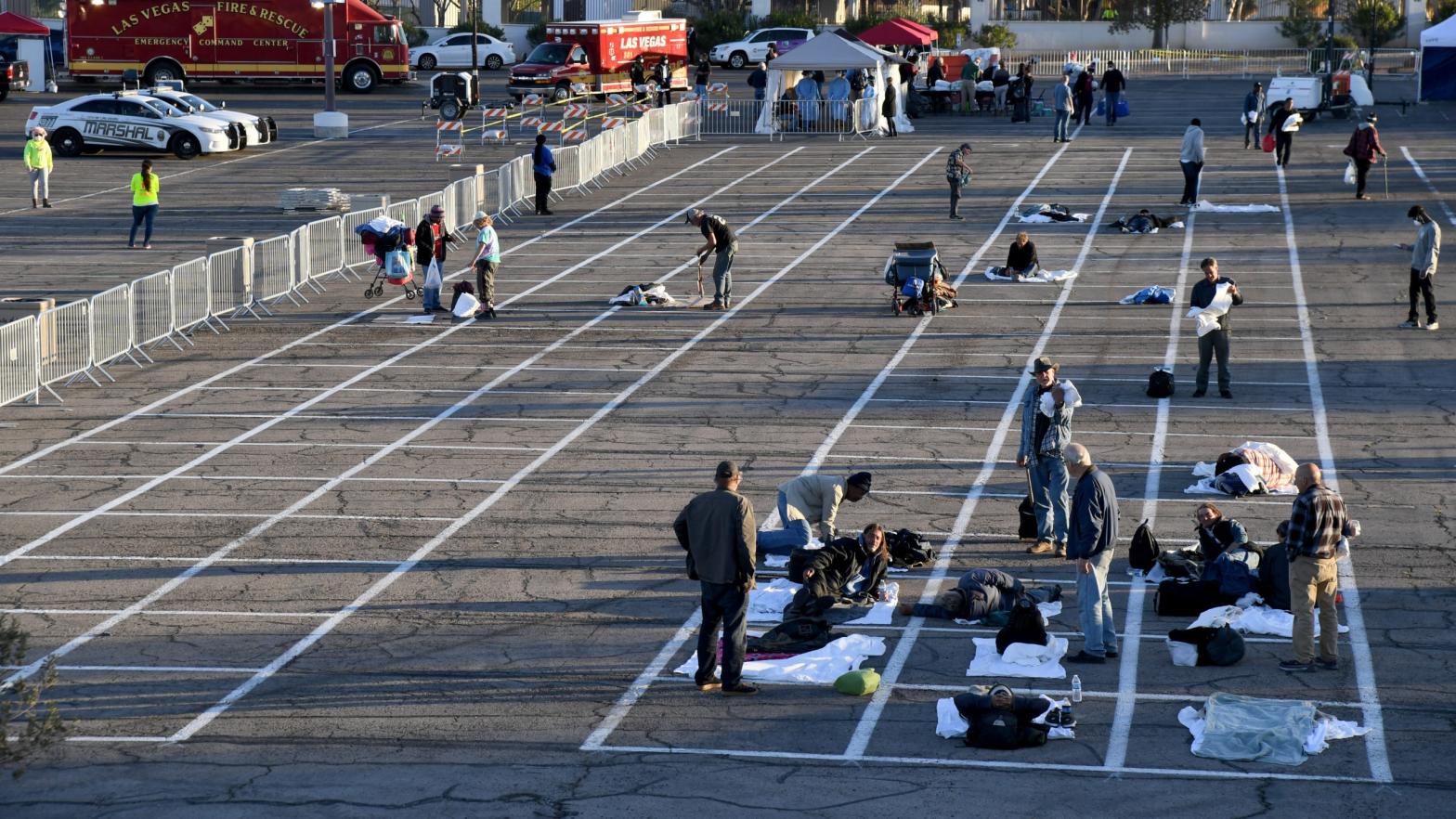 People arrive at a temporary homeless shelter with painted social-distancing boxes in a parking lot at Cashman Centre on March 30, 2020 in Las Vegas, Nevada. (Photo: Ethan Miller, Getty Images)