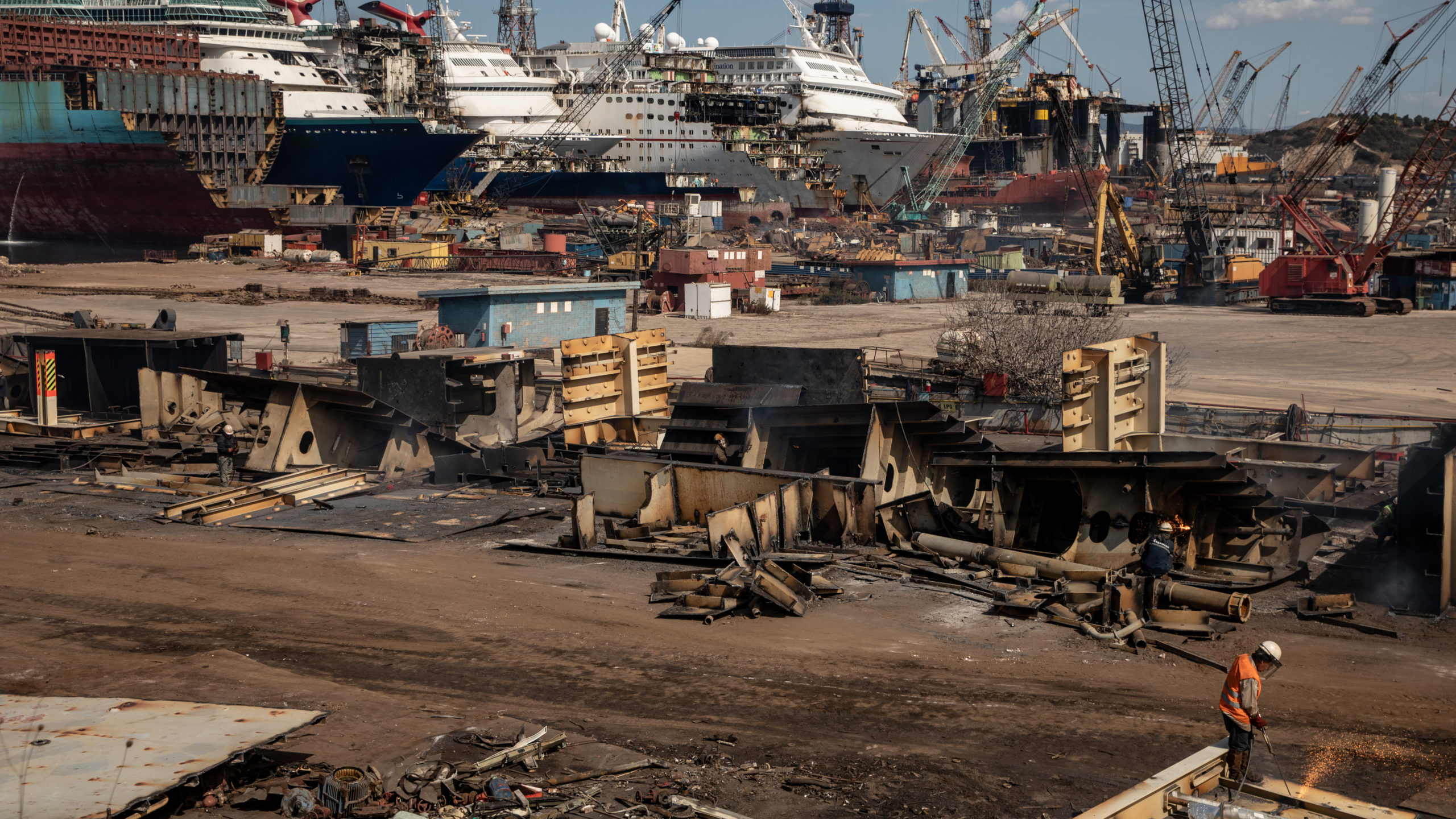 A man works at a ship recycling yard in front of five luxury cruise ships that are being broken down for scrap metal at the Aliaga ship recycling port on October 02, 2020 in Izmir, Turkey.  (Photo: Chris McGrath, Getty Images)
