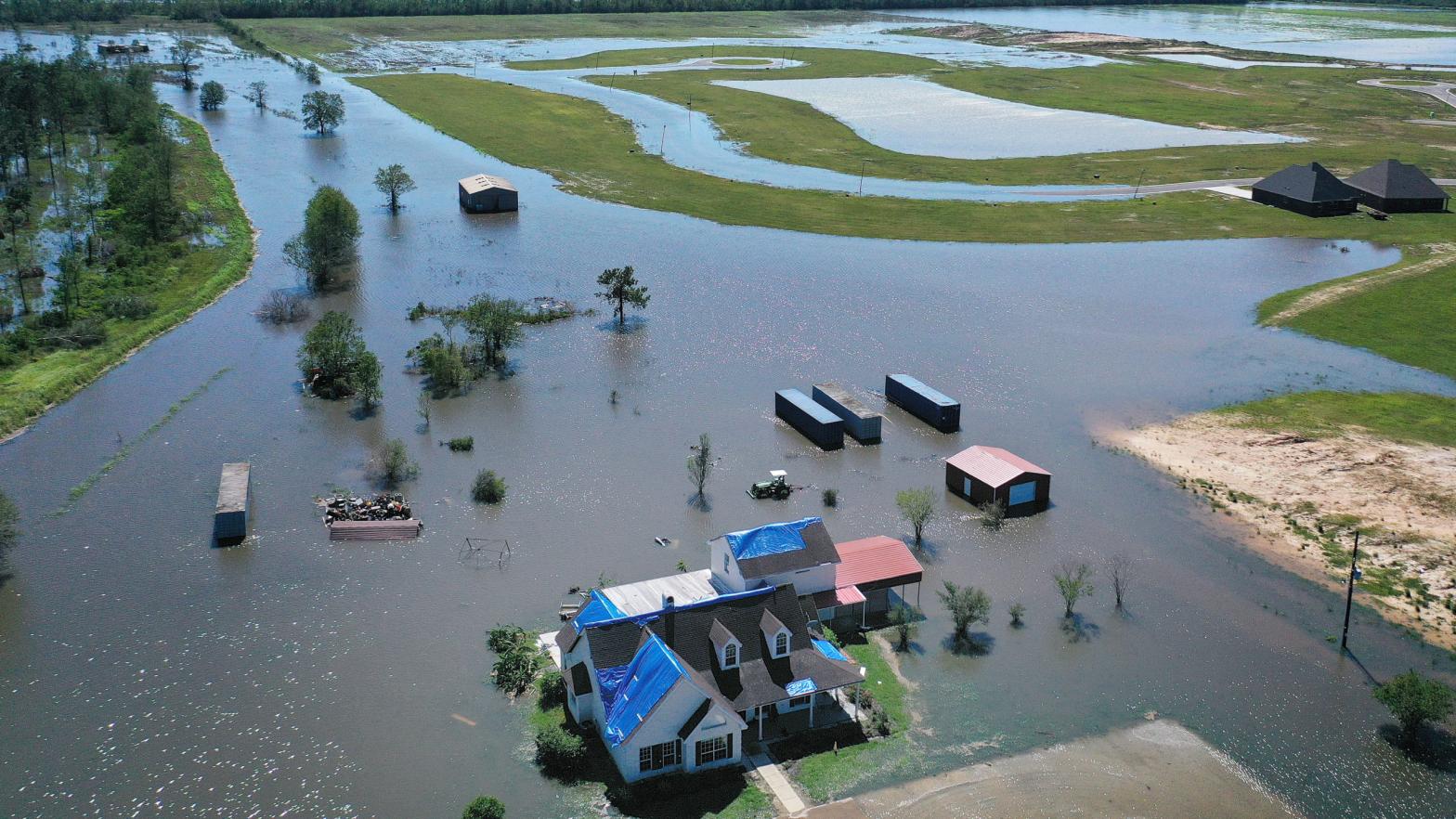 In this aerial view from a drone, a model home is surrounded by floodwaters from Hurricane Delta on October 10, 2020, in Iowa, Louisiana. Hurricane Delta made landfall as a Category 2 storm in Louisiana initially leaving hundreds of thousands of customers without power.  (Photo: Mario Tama, Getty Images)