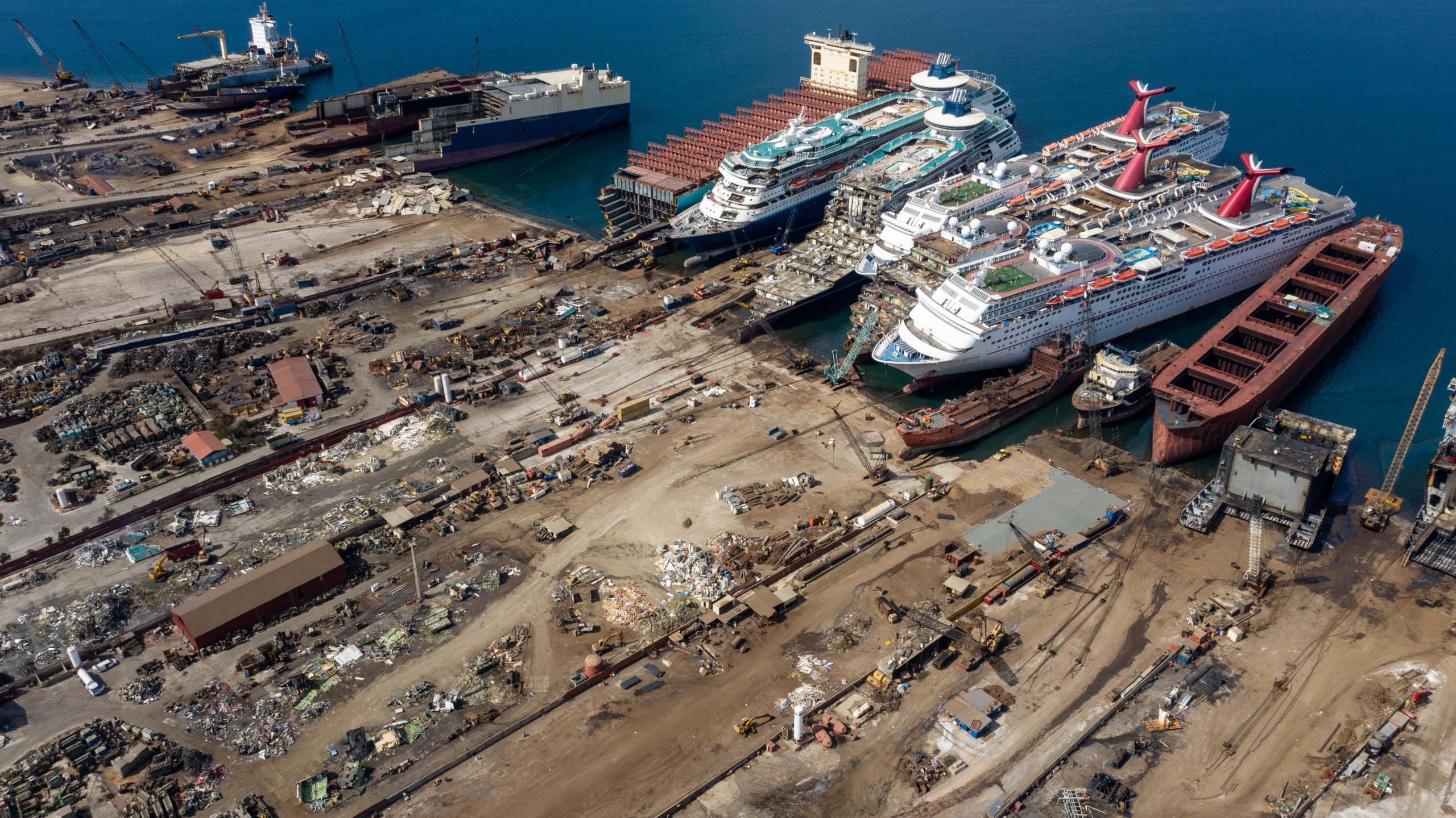 In this aerial view from a drone, five luxury cruise ships are seen being broken down for scrap metal at the Aliaga ship recycling port on October 02, 2020 in Izmir, Turkey.  (Photo: Chris McGrath, Getty Images)