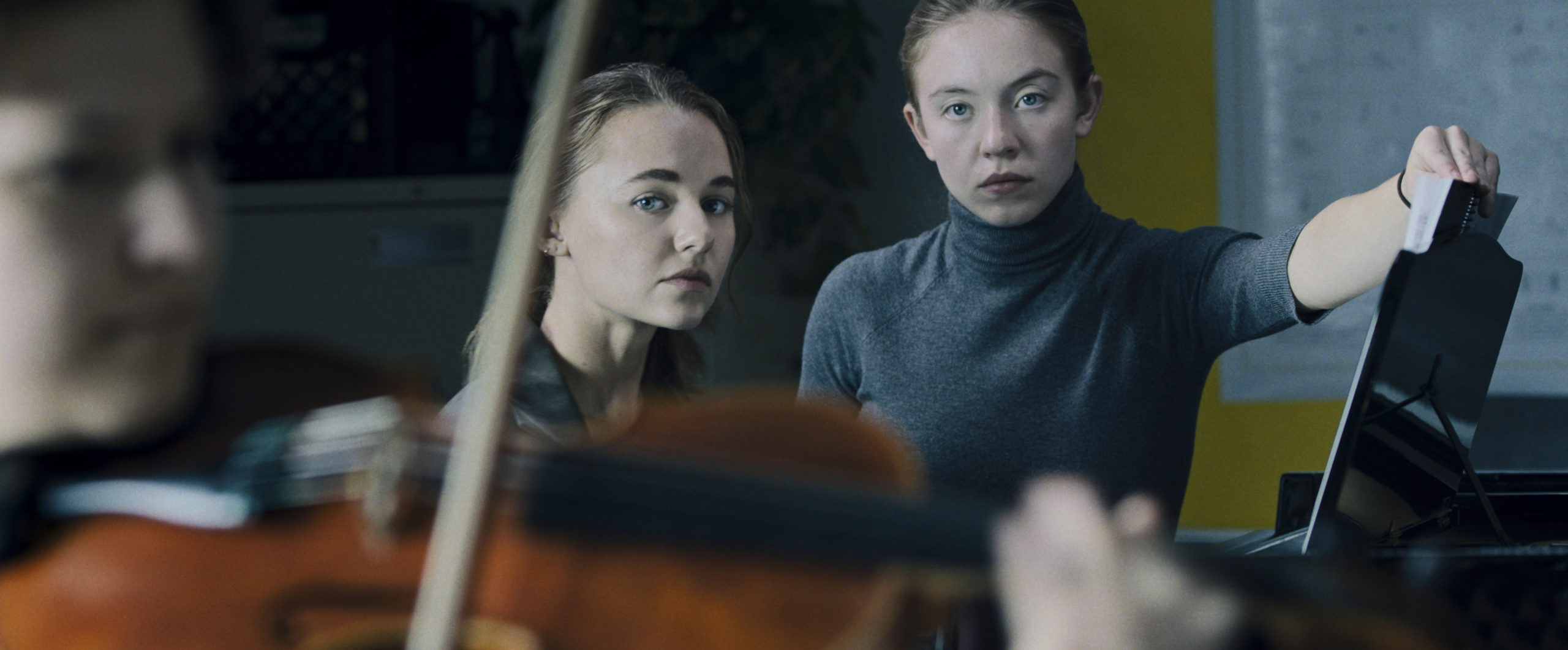 Vivian (Madison Iseman) practices while Juliet (Sydney Sweeney) turns the pages and dies inside in Nocturne. (Image: Amazon Studios)
