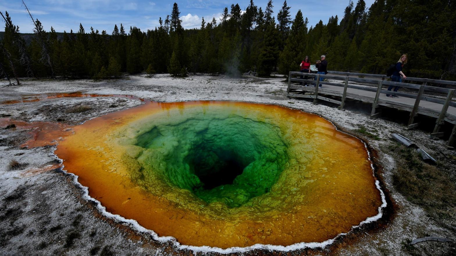 Tourists view the Morning Glory hot spring in the Upper Geyser Basin of Yellowstone National Park in Wyoming. (Photo: Mark Ralston/AFP, Getty Images)