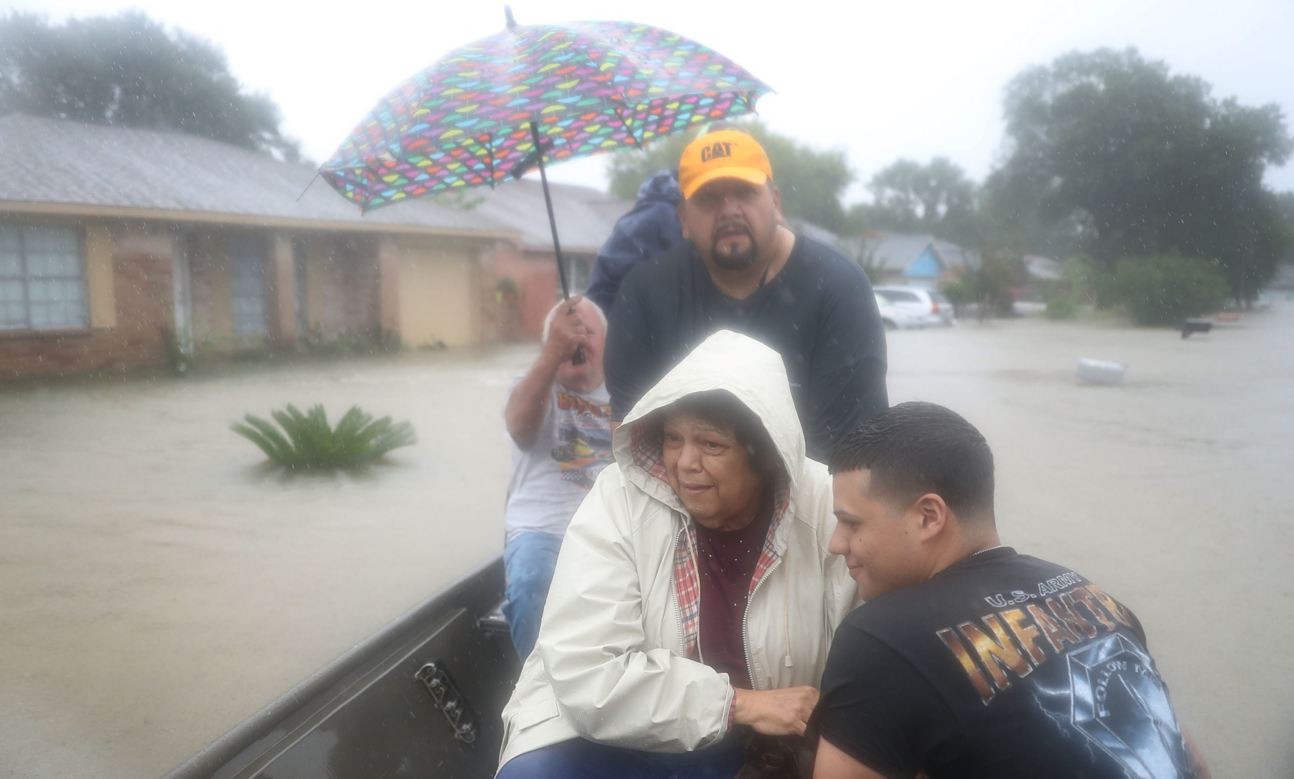 People evacuate in a boat from their homes after the area was inundated with flooding from Hurricane Harvey on Aug. 28, 2017 in Houston. (Photo: Joe Raedle, Getty Images)