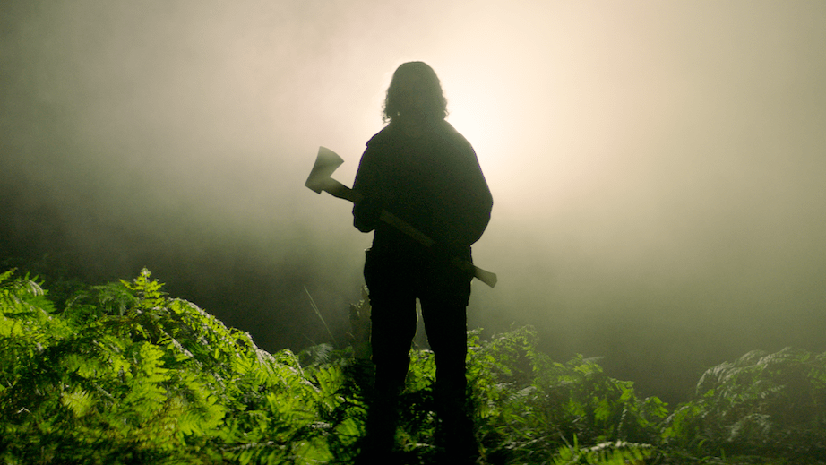 A man wielding an axe in Neon's In the Earth. (Photo: NEON)