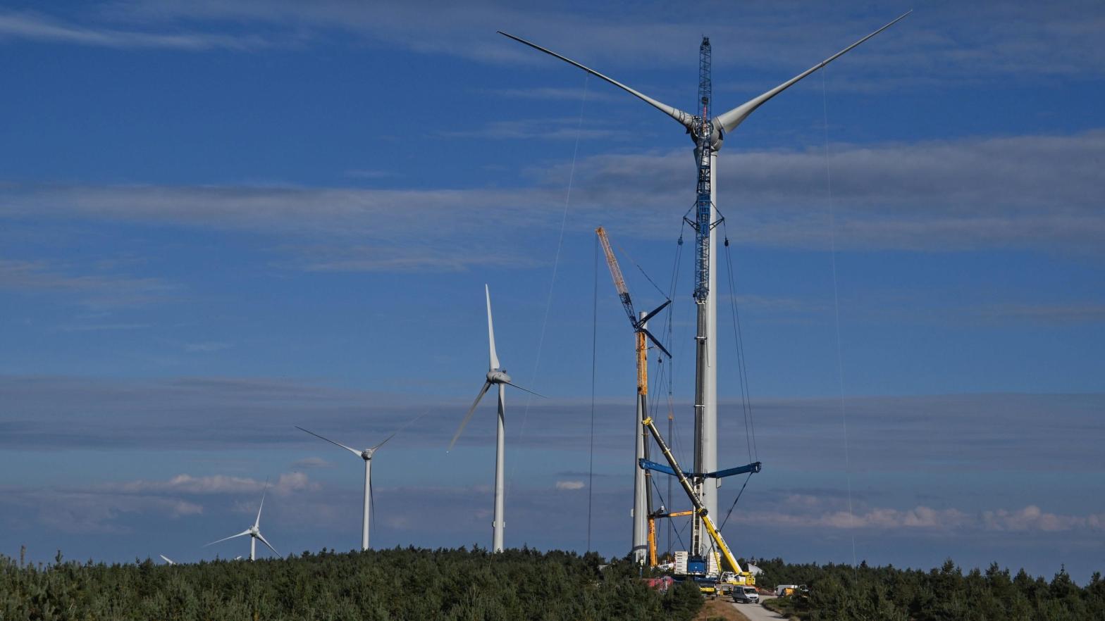 Workers install a wind turbines on September 9, 2020 in the Ardeche mountain near Lanarce, central France.  (Photo: Phillipe Desmazes, Getty Images)