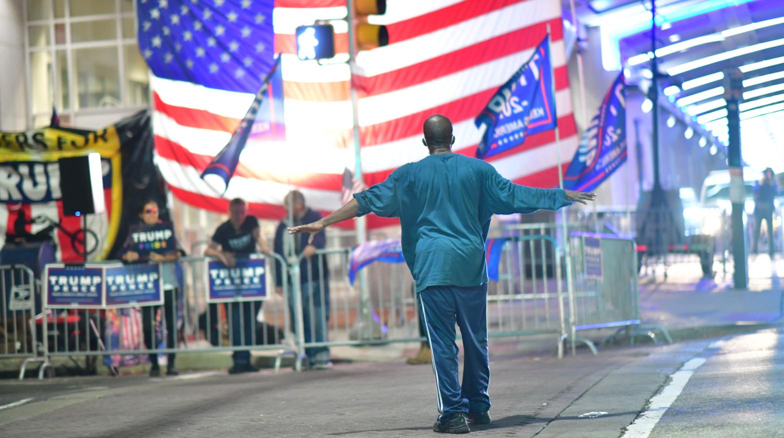 A man approaches supporters of President Donald Trump demonstrating outside of where votes were being counted six days after the general election on November 9, 2020 in Philadelphia. (Photo: Mark Makela, Getty Images)