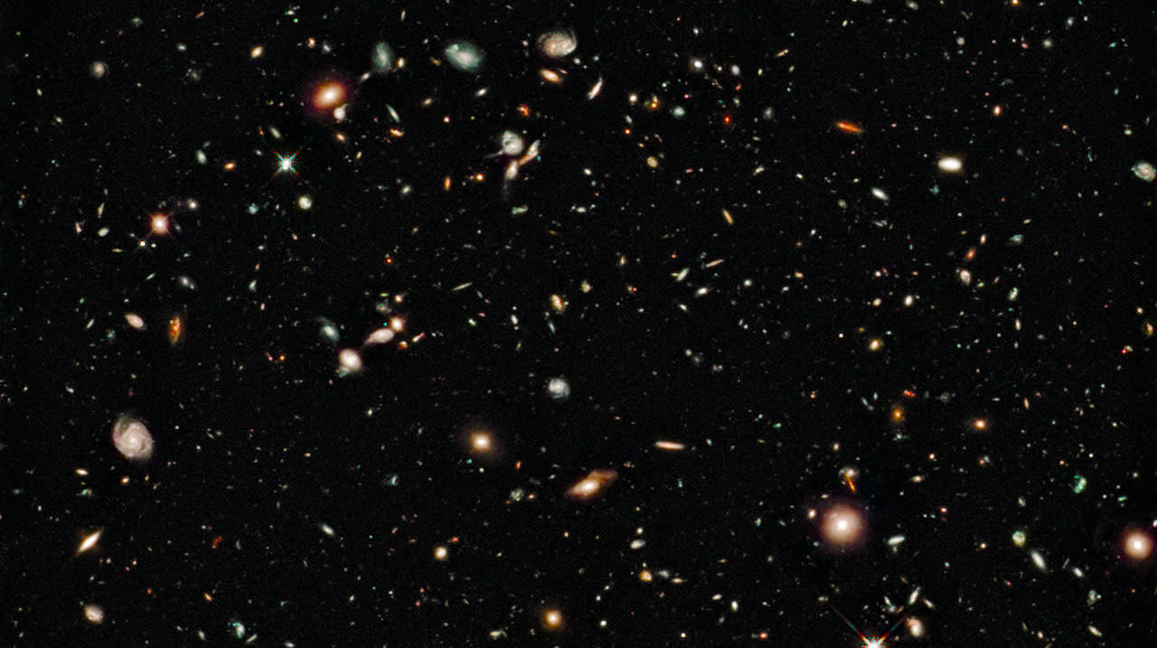 A Hubble deep space image showing some of the oldest known galaxies.  (Image: Hubble/NASA/ESA)