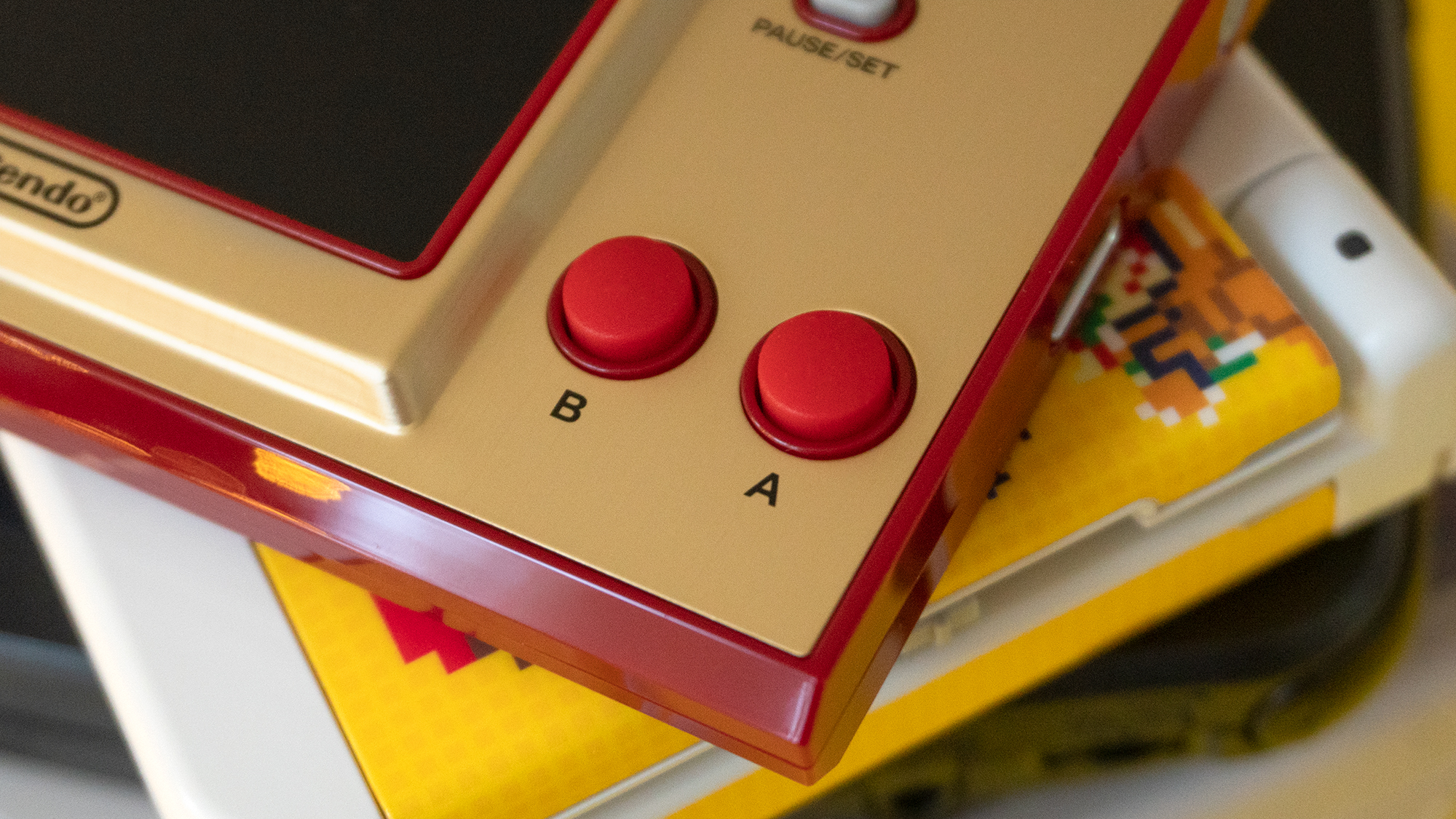 Rubber action buttons? That's how the original Game & Watch device's rolled, and these feel just fine, even if they're not smooth plastic. (Photo: Andrew Liszewski - Gizmodo)