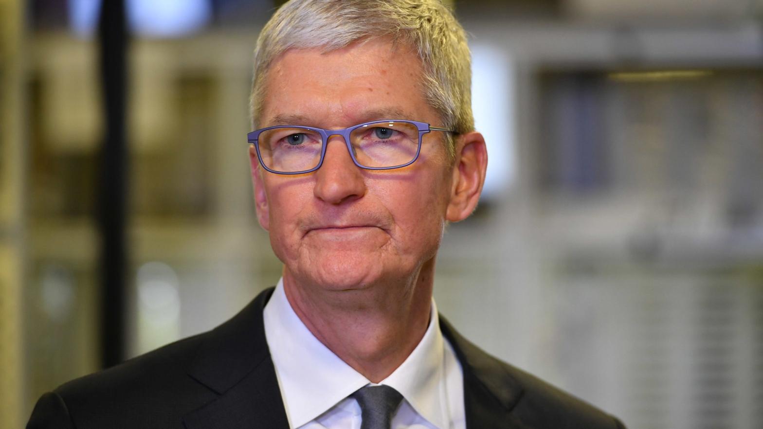 Apple CEO Tim Cook makes his settlement face. (Photo: Mandel Ngan, Getty Images)