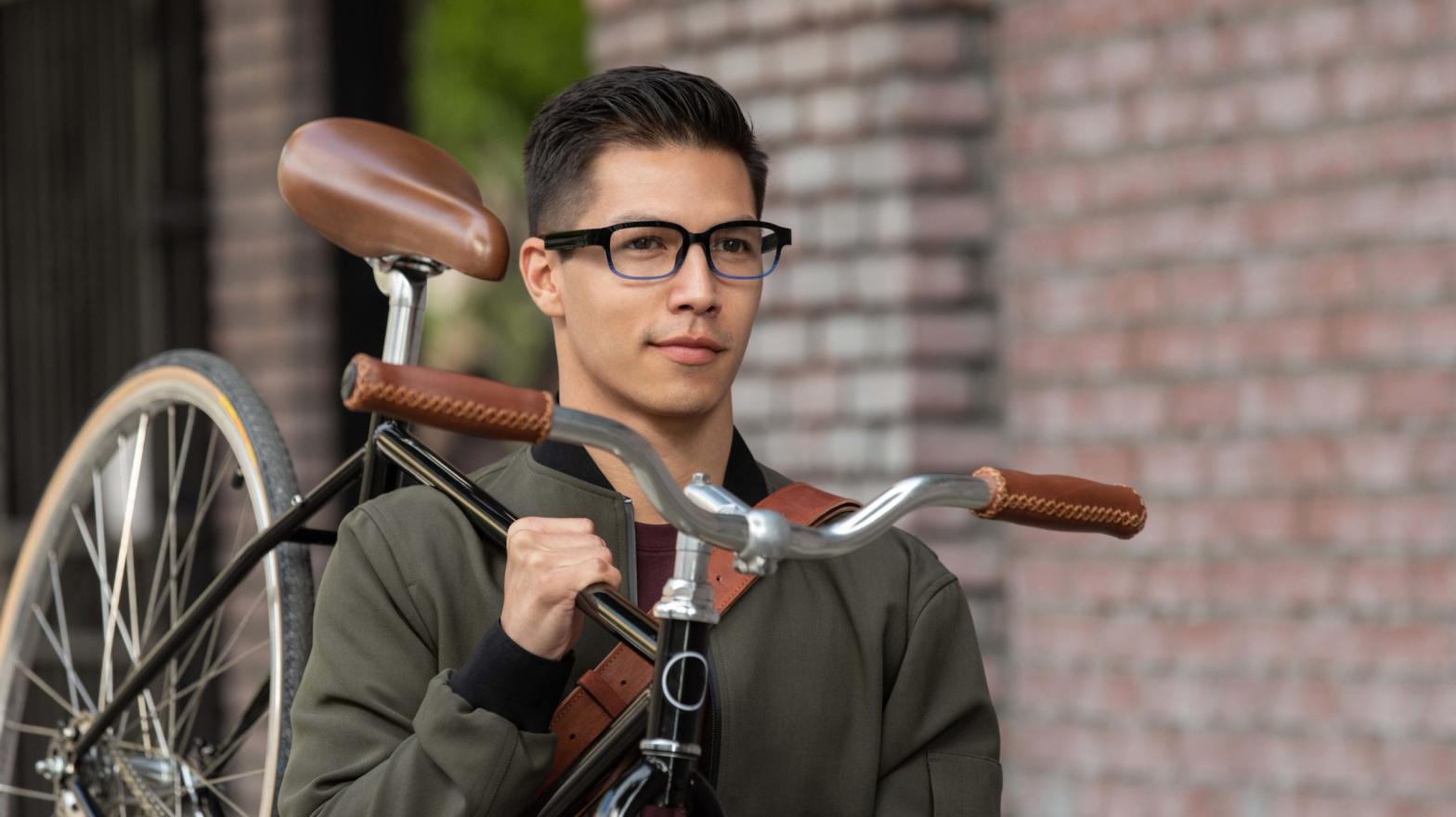 I don't know why Amazon decided a guy carrying a bike while wearing Echo Frames is the way to go for product shots, but here we are. (Image: Amazon)