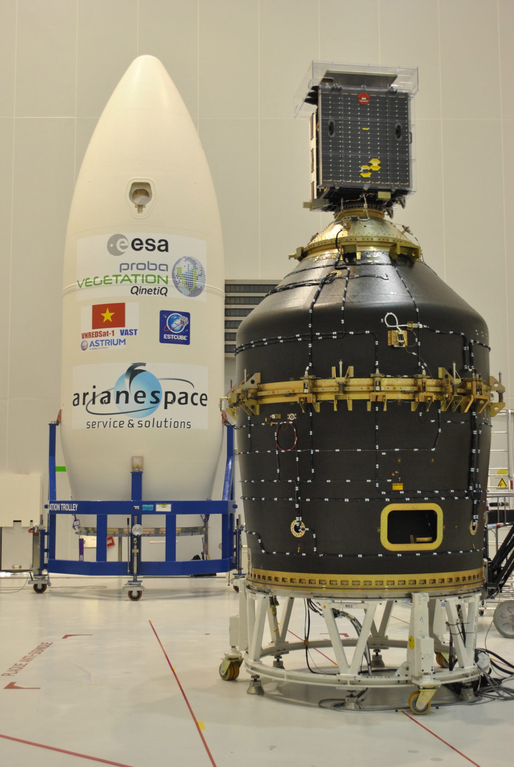 Archival image from 2013 showing the Vespa (Vega Secondary Payload Adaptor) adaptor in the background, with the Proba-V satellite in the foreground.  (Image: ESA - Karim Mellab)