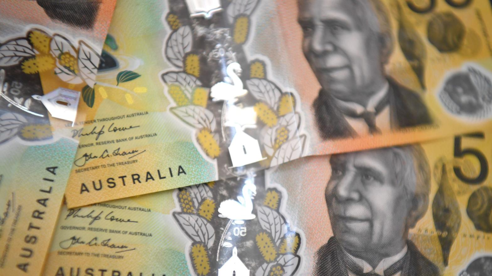 This photo illustration shows three Australian banknotes taken in Melbourne on October 12, 2020. (Photo: William West, Getty Images)