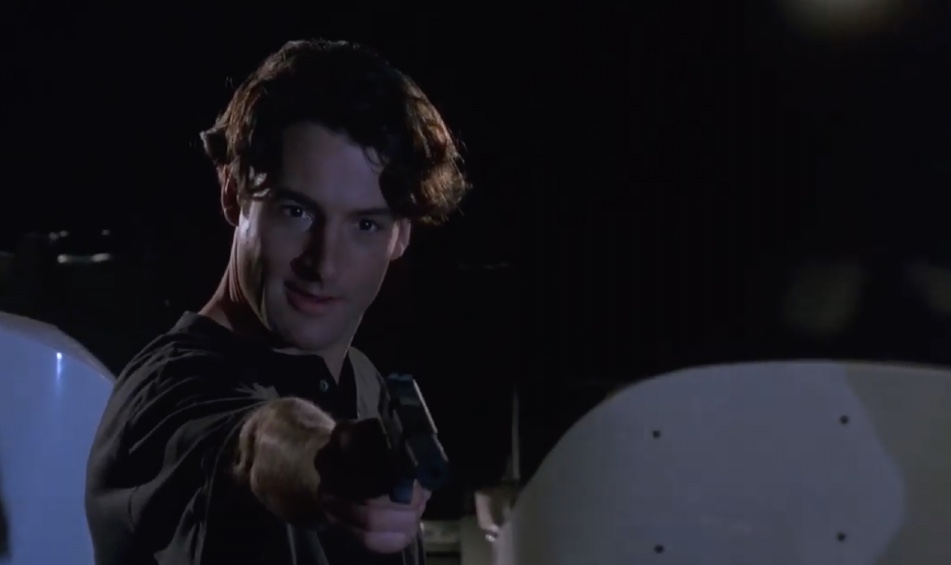 Jack Devlin (Jeremy Northam) is terrible at killing people but really good at ruining vacations. (Screenshot: Sony)
