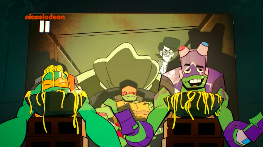 The Ninja Turles being slobs during movie night. (Screenshot: Nickelodeon)