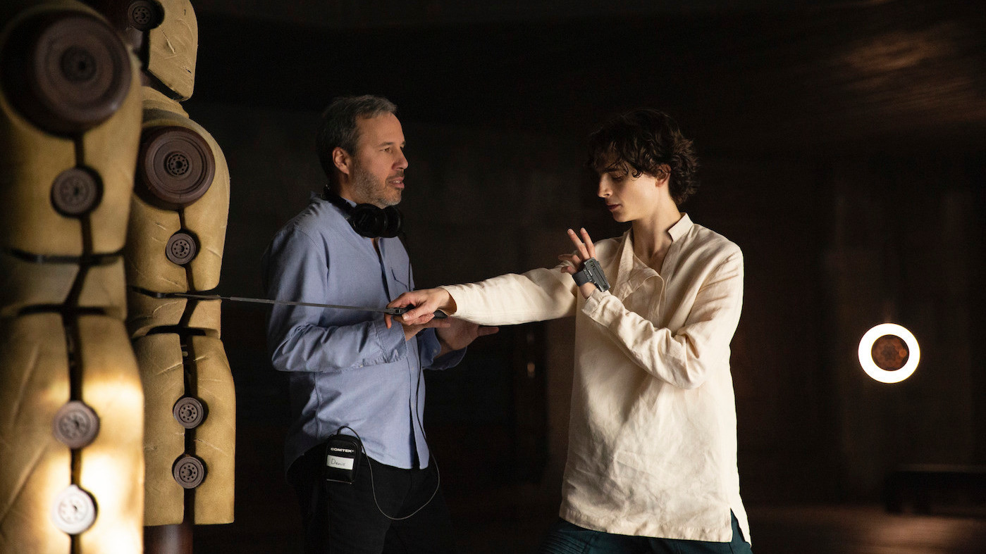 Denis Villeneuve works with star Timothée Chalamet on the set of Dune.  (Image: Warner Bros.)