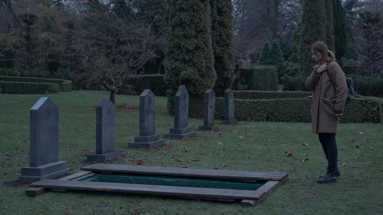 Astrid (Danica Curcic) looks upon a peculiar grave.  (Image: Netflix)