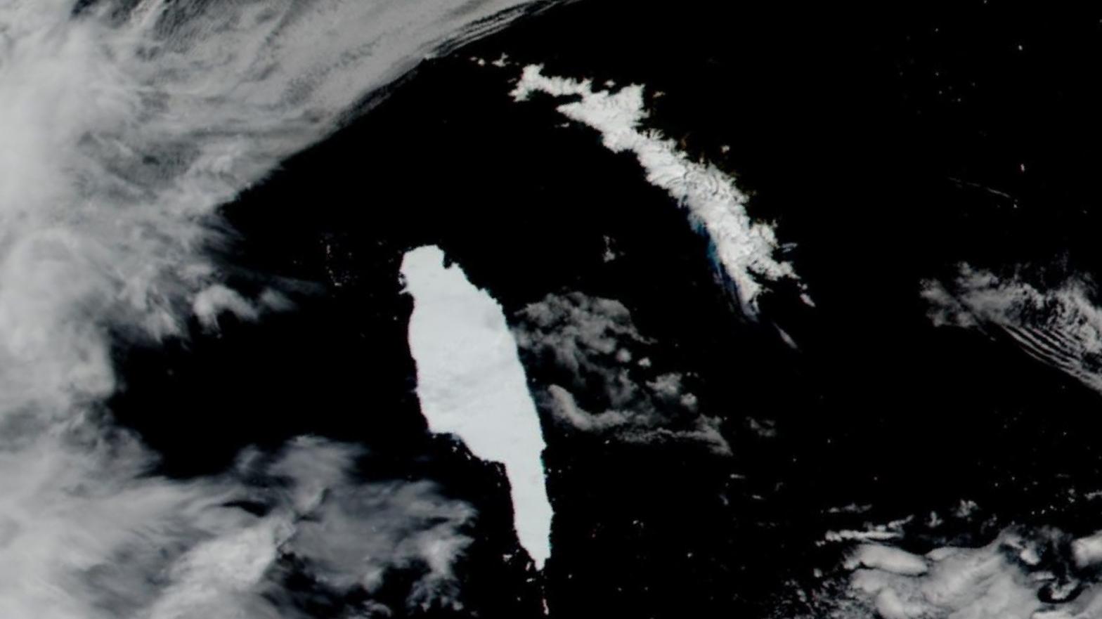 Iceberg A68a (the object shaped like a hand pointing downward) approaching South Georgia island. (Image: Lauren Dauphin/MODIS/NASA EOSDIS/LANCE/GIBS/Worldview)