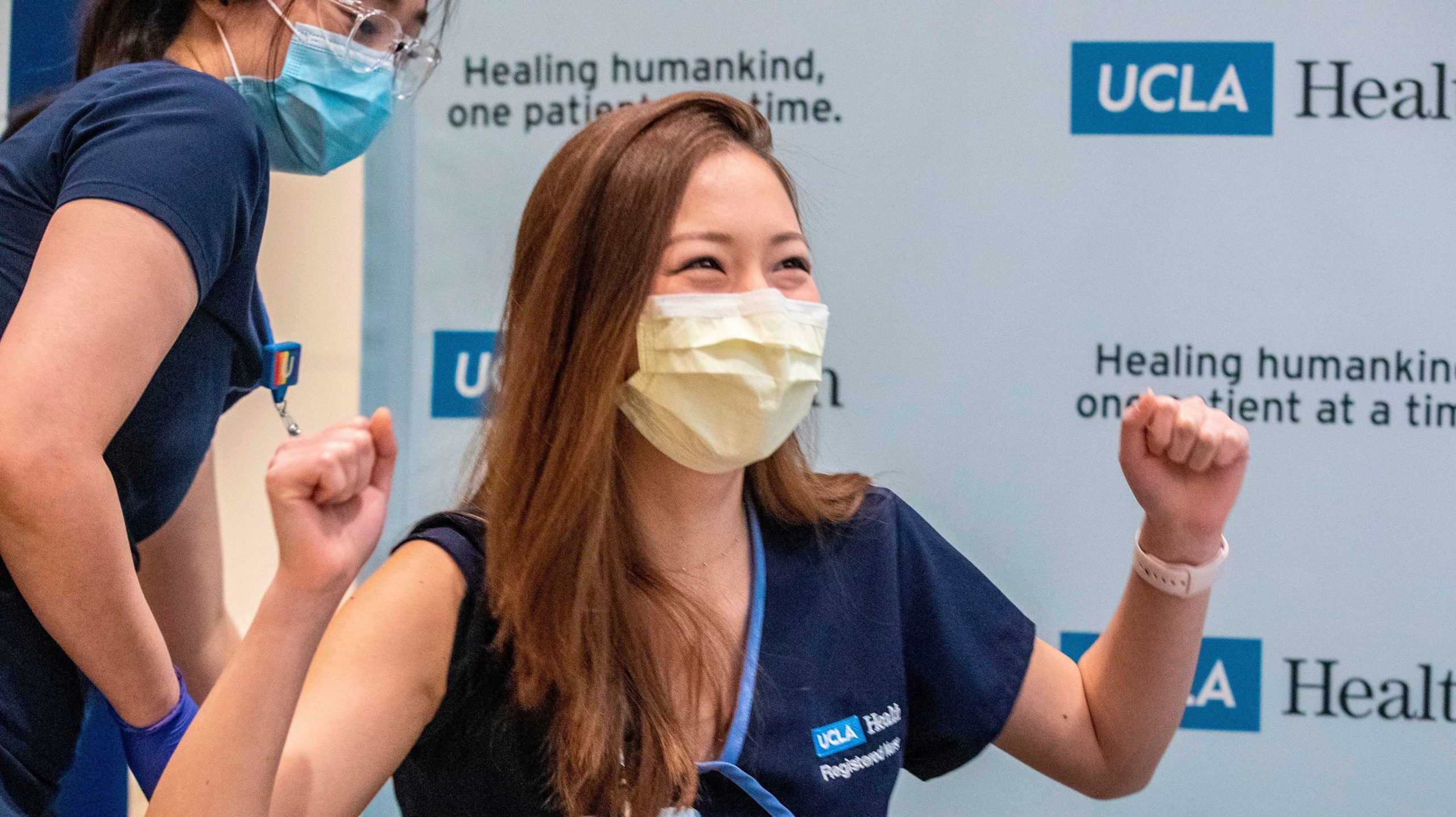 Nurse Nicole Chang celebrates after receiving one of the first injections of the covid-19 vaccine at Ronald Reagan UCLA Medical Centre in Westwood, California on December 16, 2020. (Photo: Brian van der Brug / POOL / AFP, Getty Images)