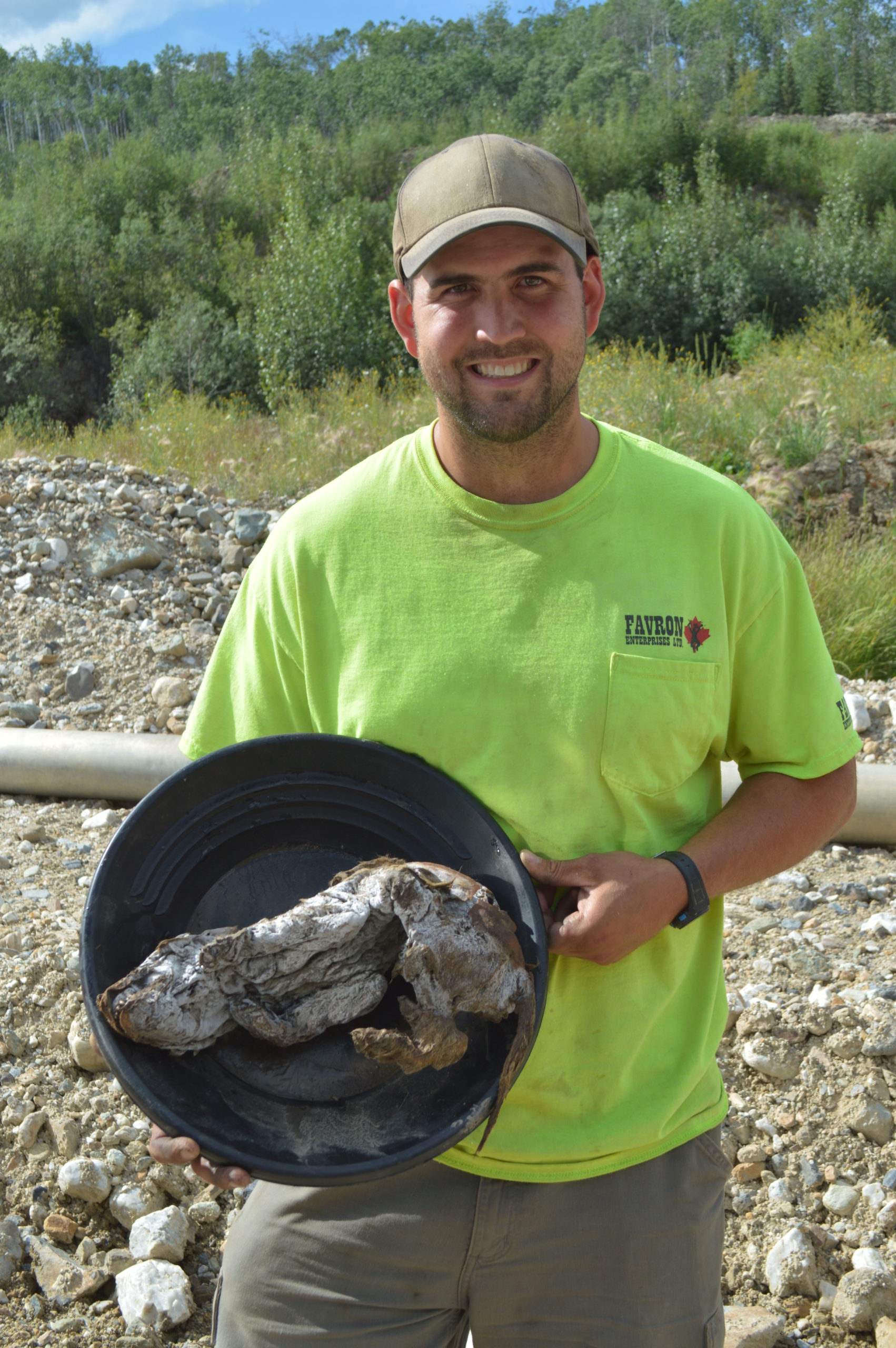 Gold miner Neil Loveless with the wolf pup he found.  (Photo: Government of Yukon)