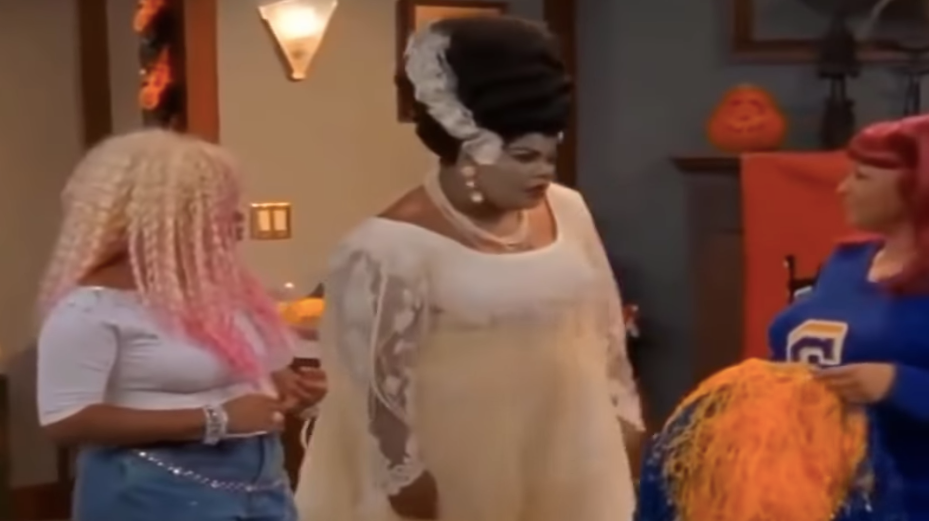 Kim, Nikki, and Andell getting ready for a Halloween party. (Screenshot: CBS)
