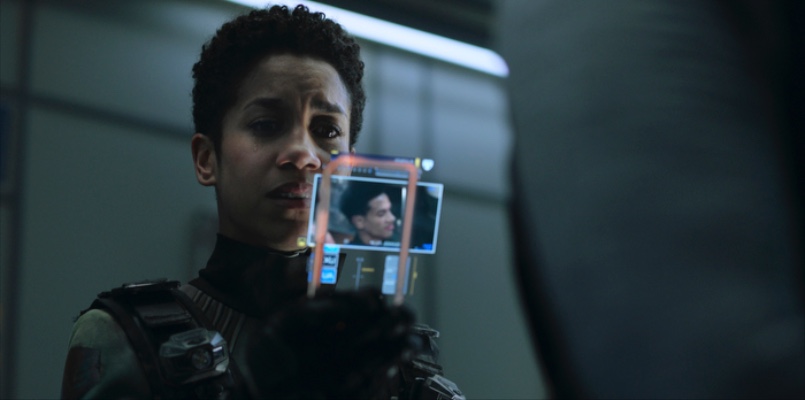 Naomi (Dominique Tipper) looks at an image of her son for the first time in years. (Image: Amazon Studios)