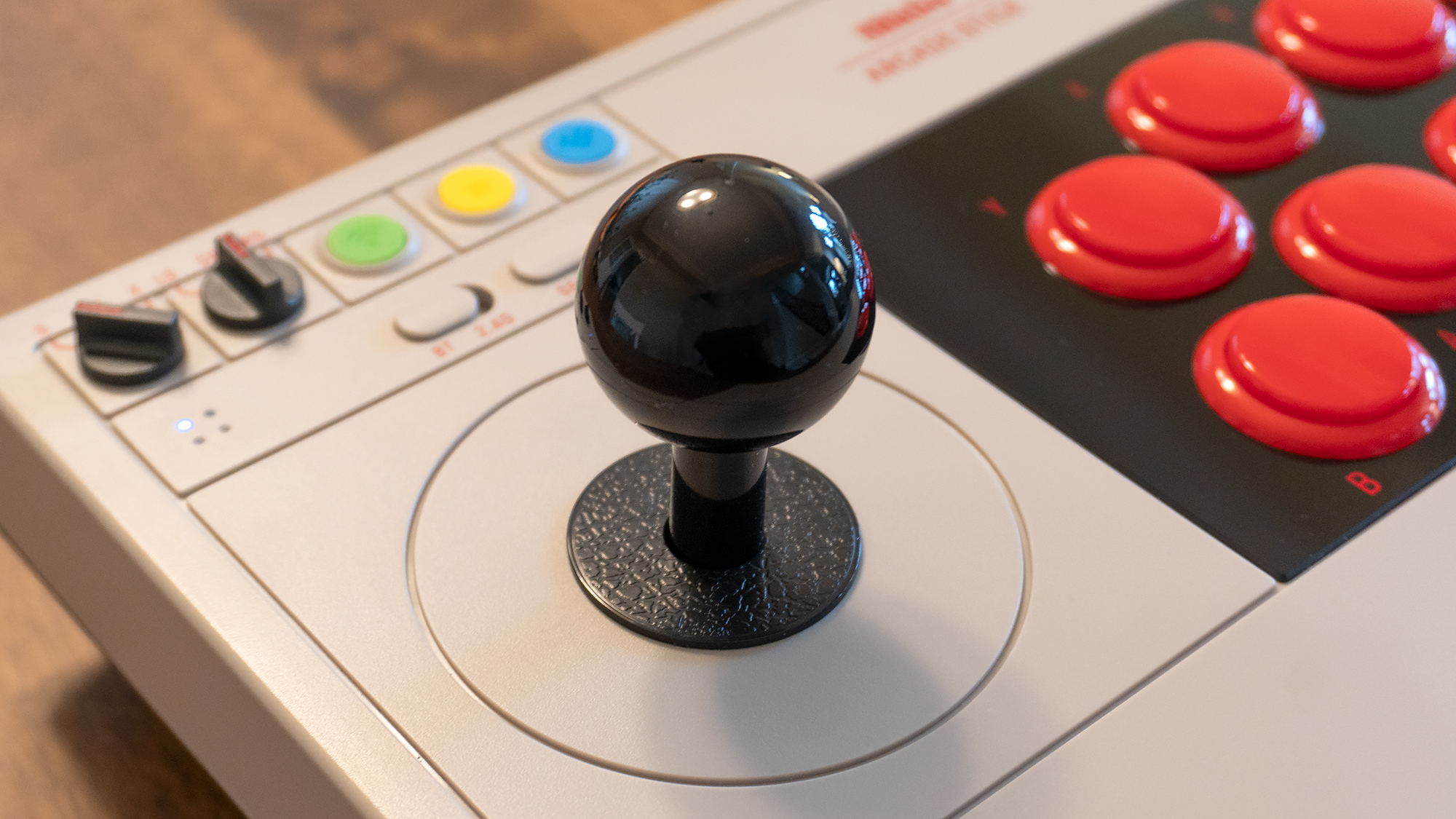 The 8BitDo's joystick doesn't offer analogue controls, it's digital only, but it feels great with subtle but satisfying clicks as you move it around. (Photo: Andrew Liszewski / Gizmodo)