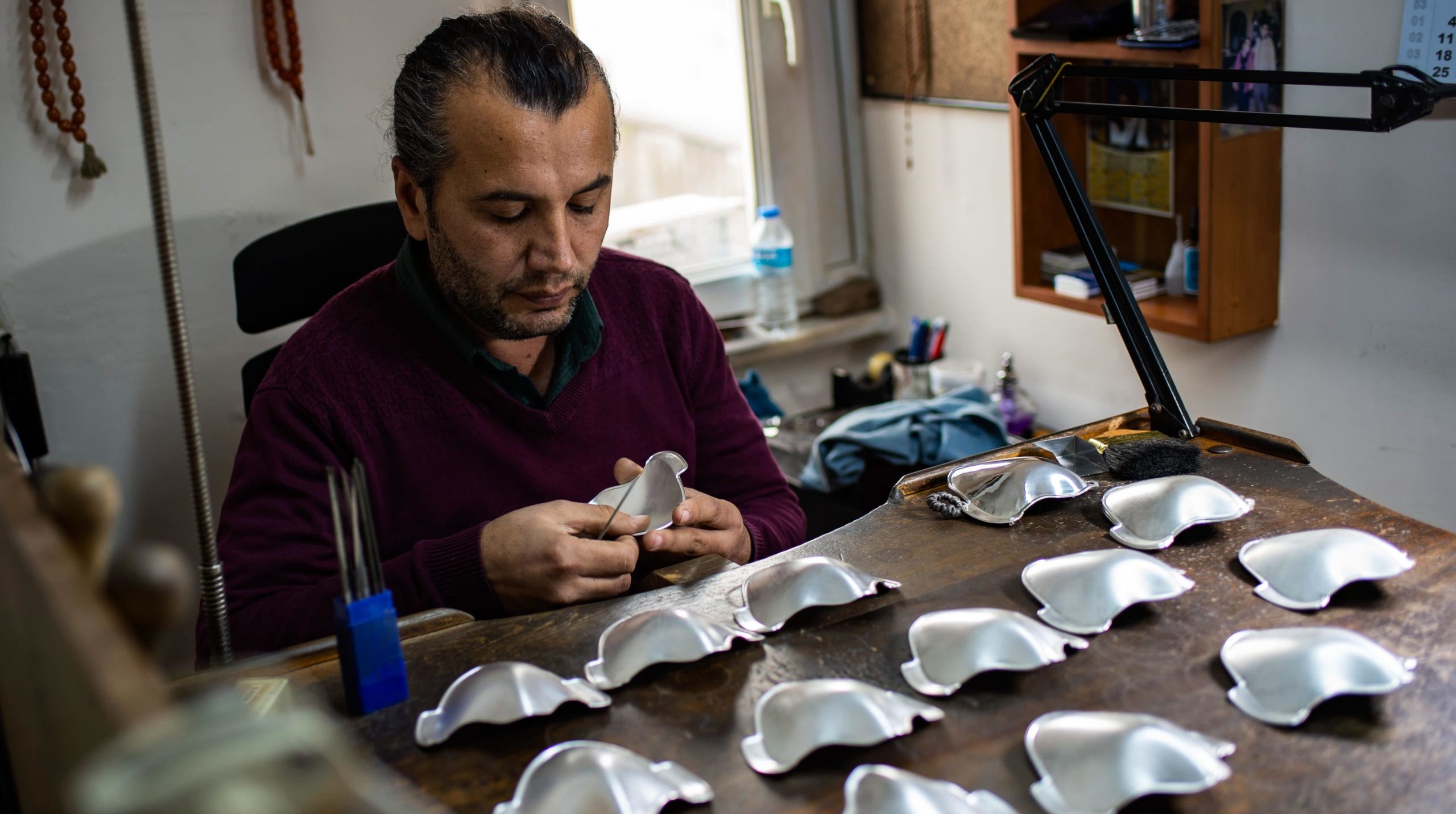 Turkish silver master Sabri Demirci works on his silver and golden protective face masks. (Photo: Yasin Akgul / AFP, Getty Images)