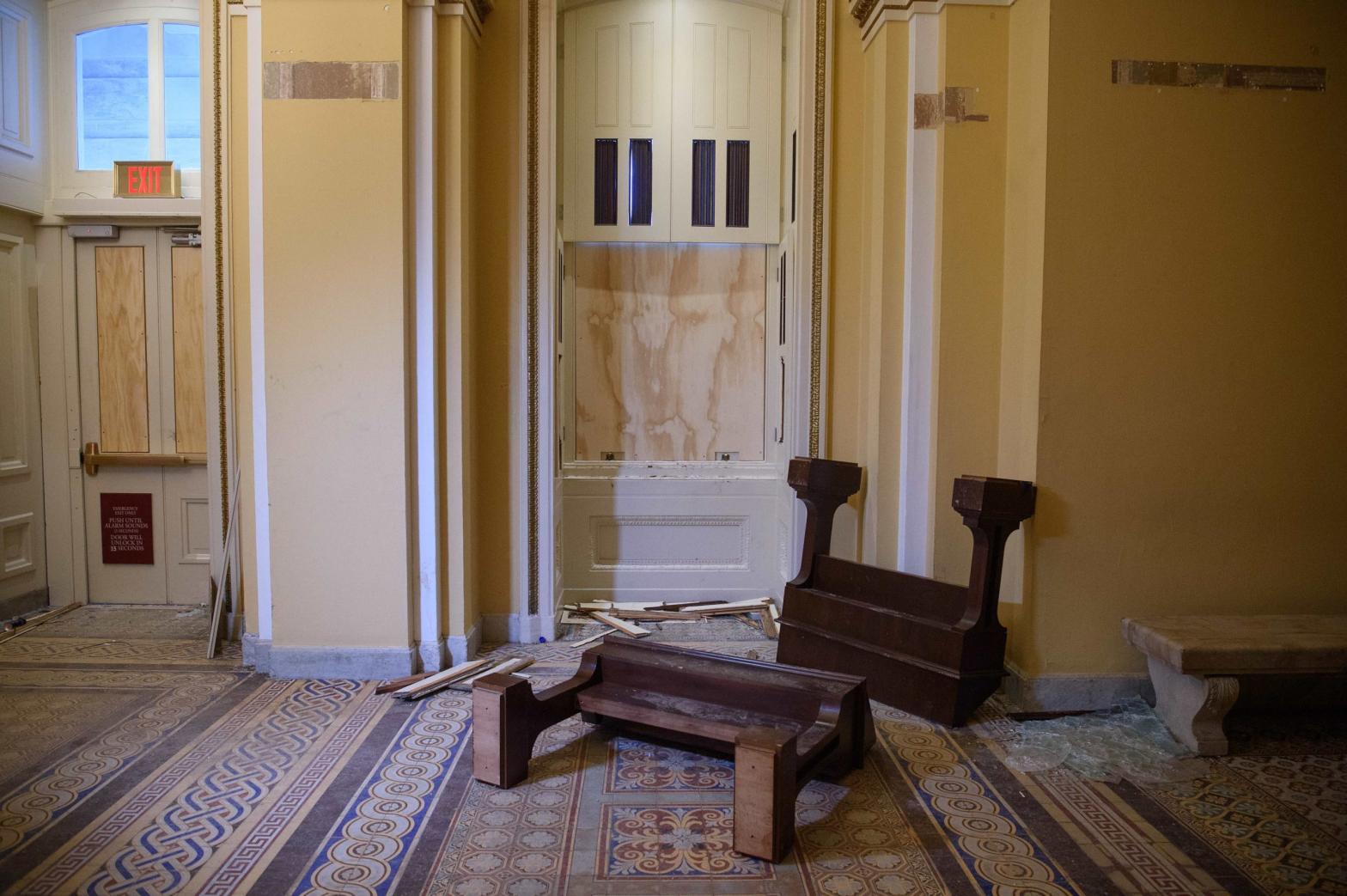 Overturned furniture and broken glass litter a hallway of the US Capitol in Washington, DC, on January 7, 2021, one day after supporters of outgoing President Donald Trump stormed the building. (Photo: Nicholas Kamm, Getty Images)