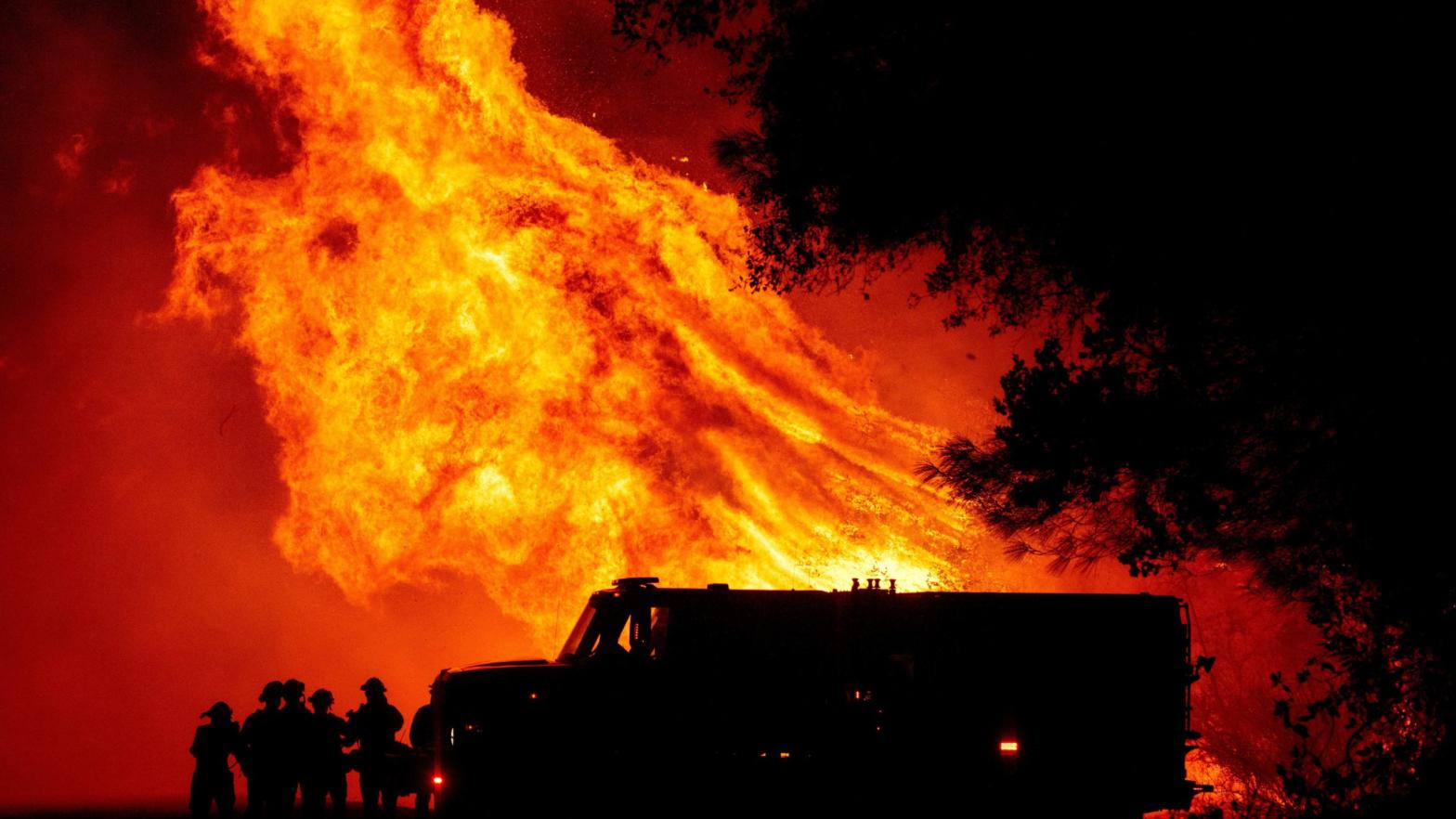Butte county firefighters watch as flames tower over their truck at the Bear Fire in Oroville, California on Sept. 9, 2020.  (Photo: Josh Edelson/AFP, Getty Images)