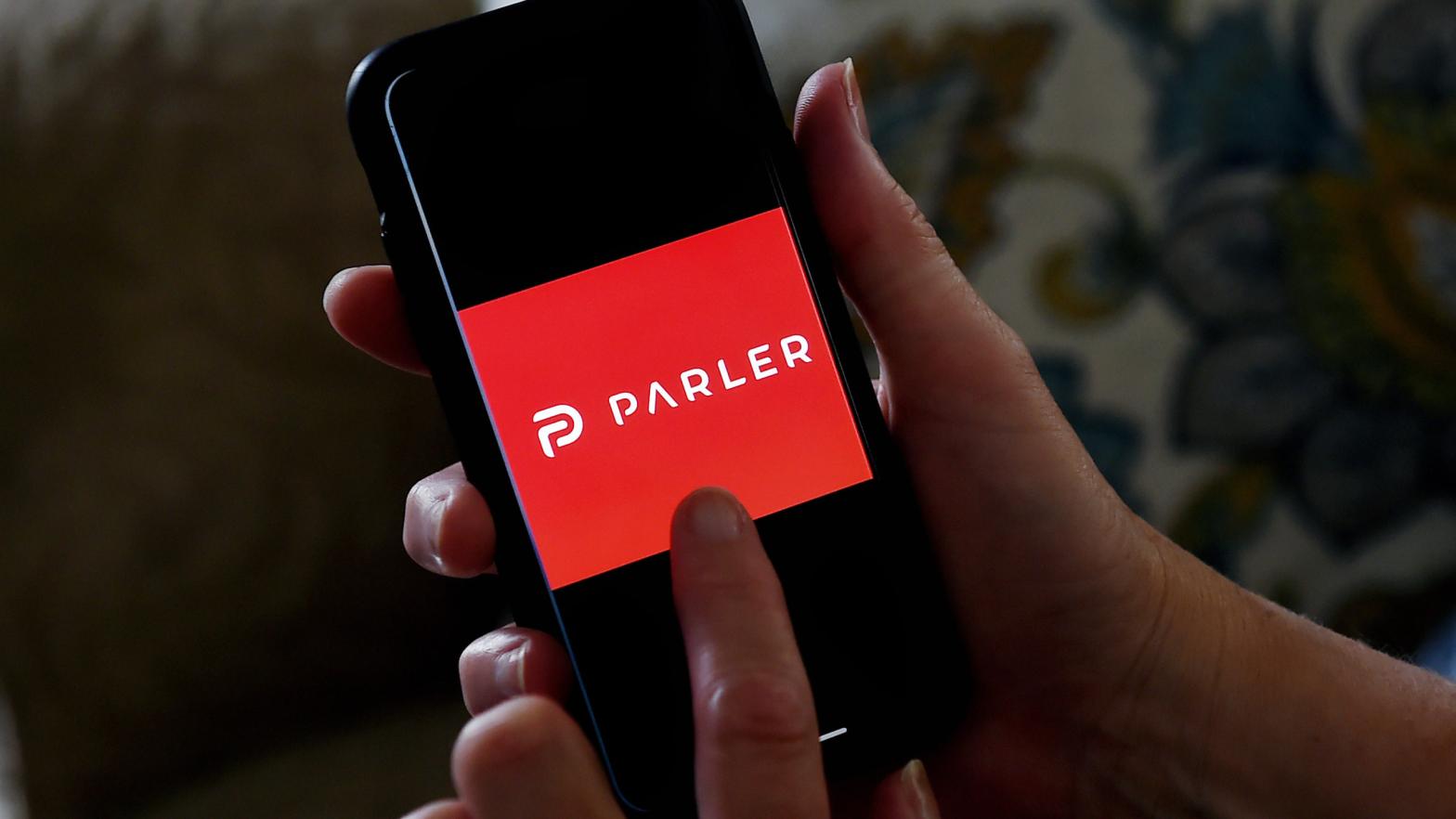This illustration picture shows social media application logo from Parler displayed on a smartphone in Arlington, Virginia on July 2, 2020 (Photo: Photo by Olivier DOULIERY / AFP) (Photo by OLIVIER DOULIERY/AFP via Getty Images, Getty Images)