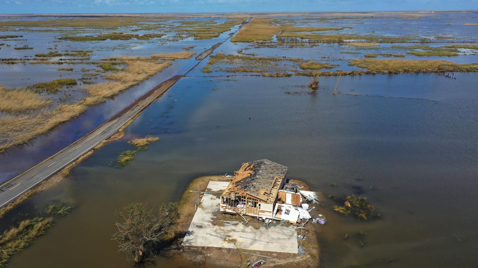 An aerial view from a drone shows a damaged home surrounded by water in Little Chenier, Louisiana following Hurricane Laura. (Photo: Joe Raedle, Getty Images)