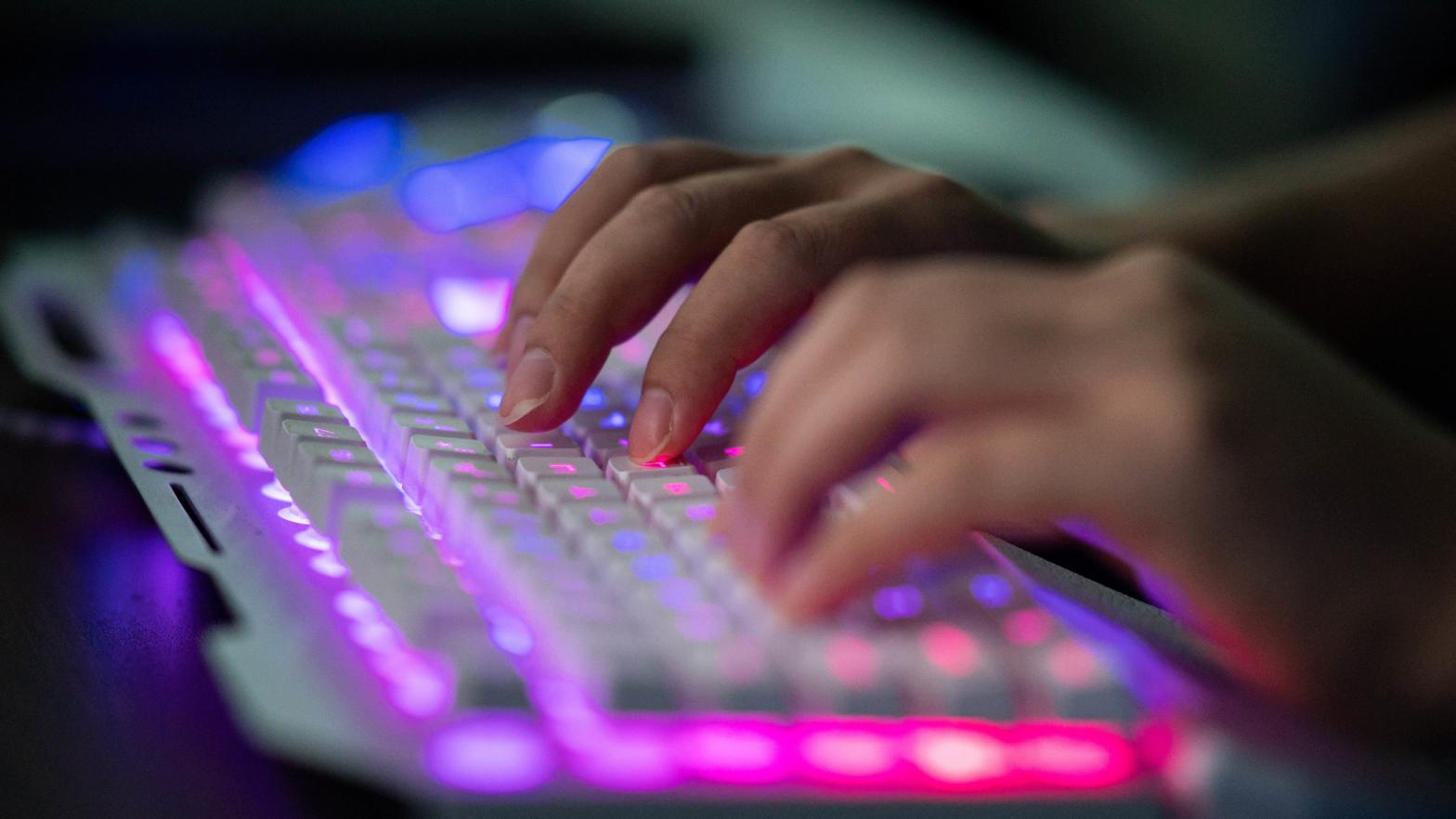 In this file photo taken on August 04, 2020, Prince, a member of the hacking group Red Hacker Alliance who refused to give his real name, uses his computer at their office in Dongguan, China's southern Guangdong province. (Photo: Photo by NICOLAS ASFOURI / AFP) (Photo by NICOLAS ASFOURI/AFP via Getty Images, Getty Images)