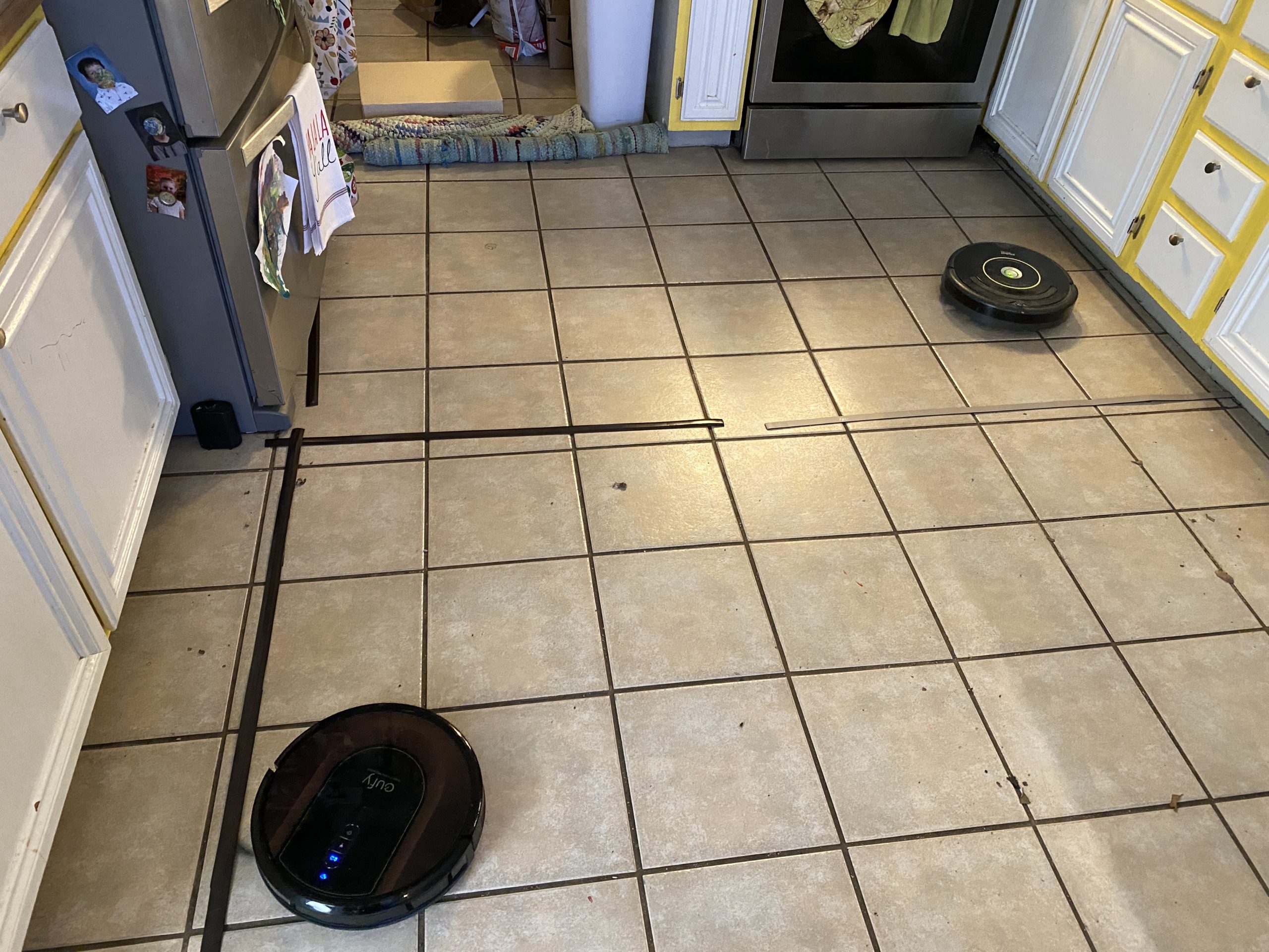I pitted the new RoboVac against my old Roomba. The Roomba took longer, but did a more thorough job too. (Photo: Wes Davis/Gizmodo)