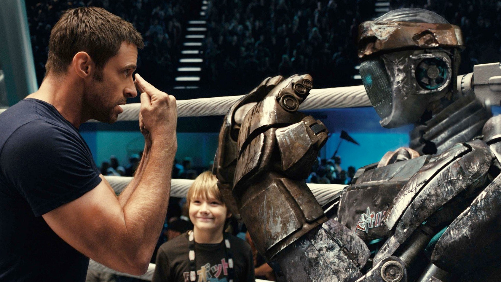 Hugh Jackman training a robot fighter in Real Steel. (Photo: Disney)