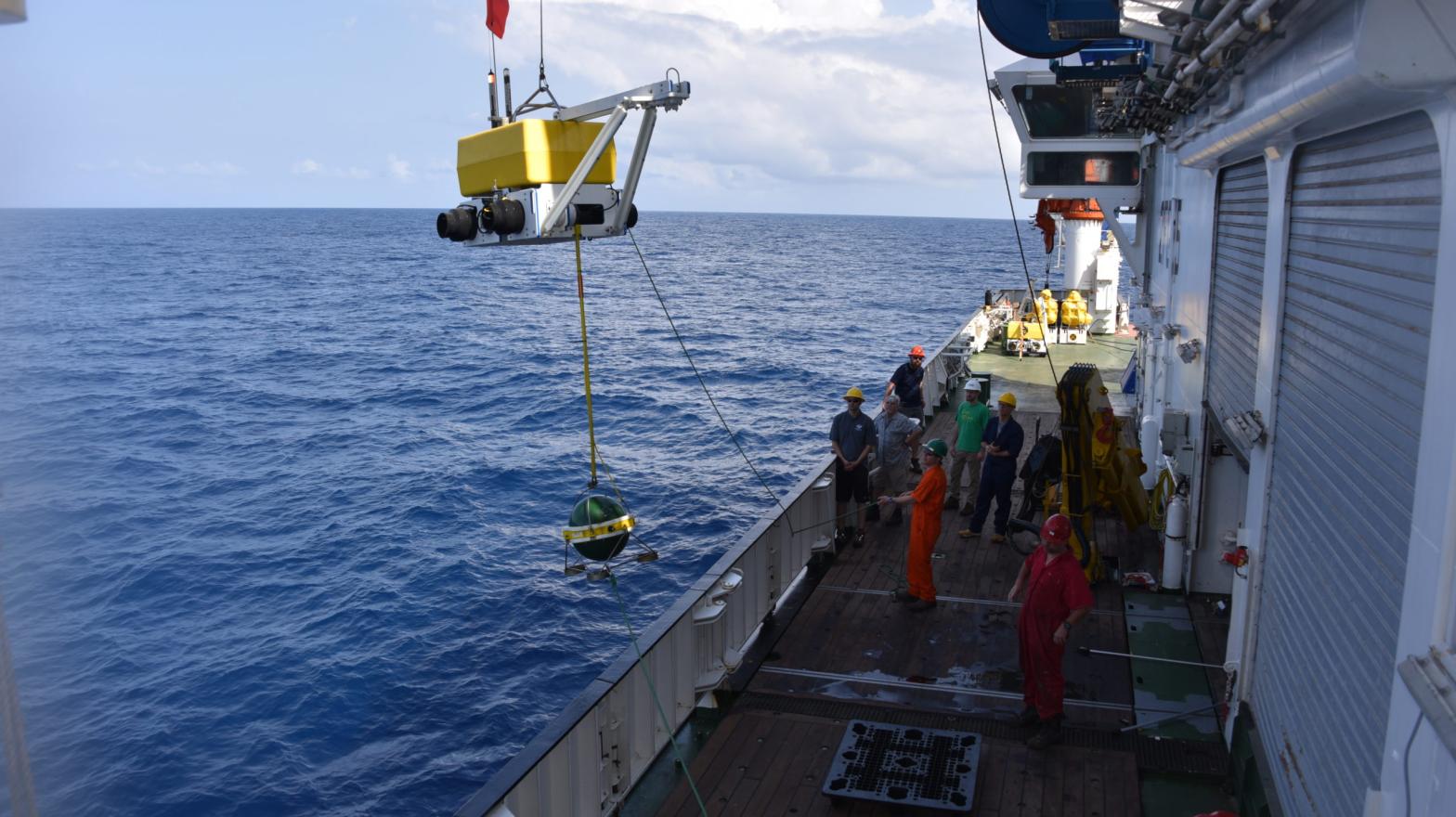 A seismometer being lifted near one of the survey sites. (Image: University of Southampton)