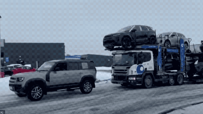 Watch One Land Rover Defender Tow A Car Hauler Loaded With Land Rovers