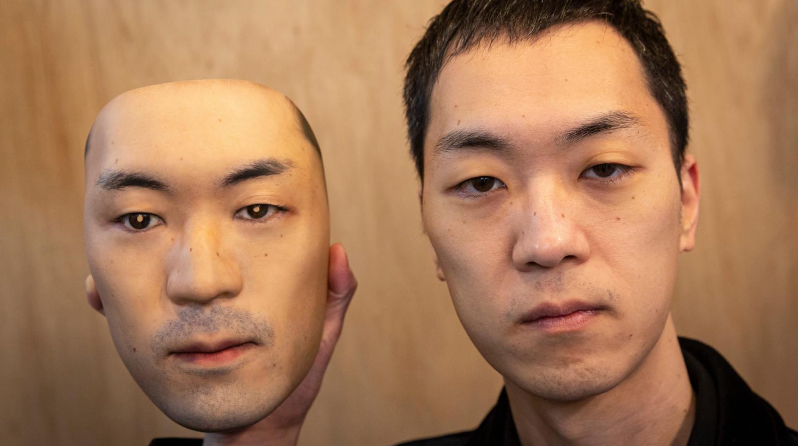 Shuhei Okawara, owner of mask shop Kamenya Omote, holding a hyper-realistic face mask poses for a portrait on January 28, 2021 in Tokyo, Japan.  (Photo: Yuichi Yamazaki, Getty Images)