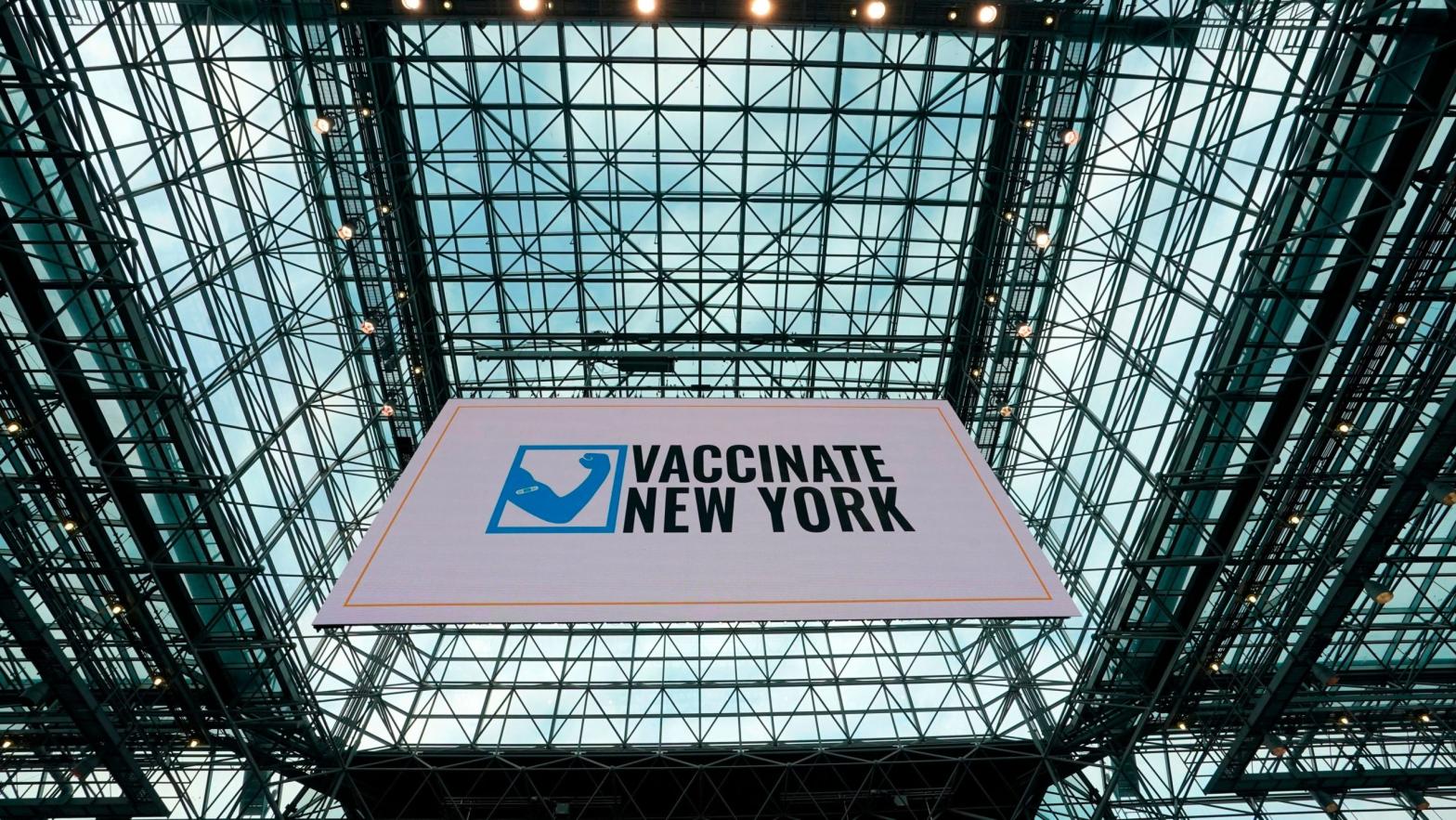 A banner hangs from the ceiling at the Jacob K. Javits Convention Centre on January 13, 2021 during a media tour of the new state vaccination site in New York City.  (Photo: Timothy A. Clary/AFP, Getty Images)