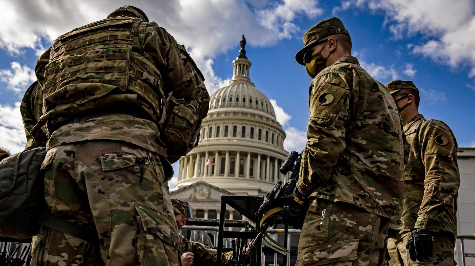 Virginia National Guard soldiers are issued their M4 rifles and live ammunition on the east front of the U.S. Capitol on January 17, 2021.  (Photo: Samuel Corum, Getty Images)