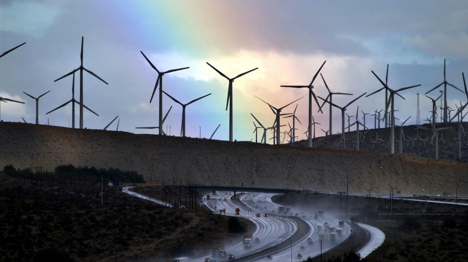 A rainbow forms behind giant windmills in California. (Photo: David McNew, Getty Images)