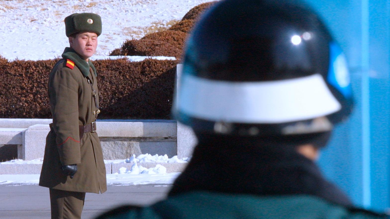A North Korean soldier watches South Korean soldiers on January 29, 2003, as he stands at the site of the signing of the 1953 armistice.  (Photo: Chung Sung-Jun, Getty Images)