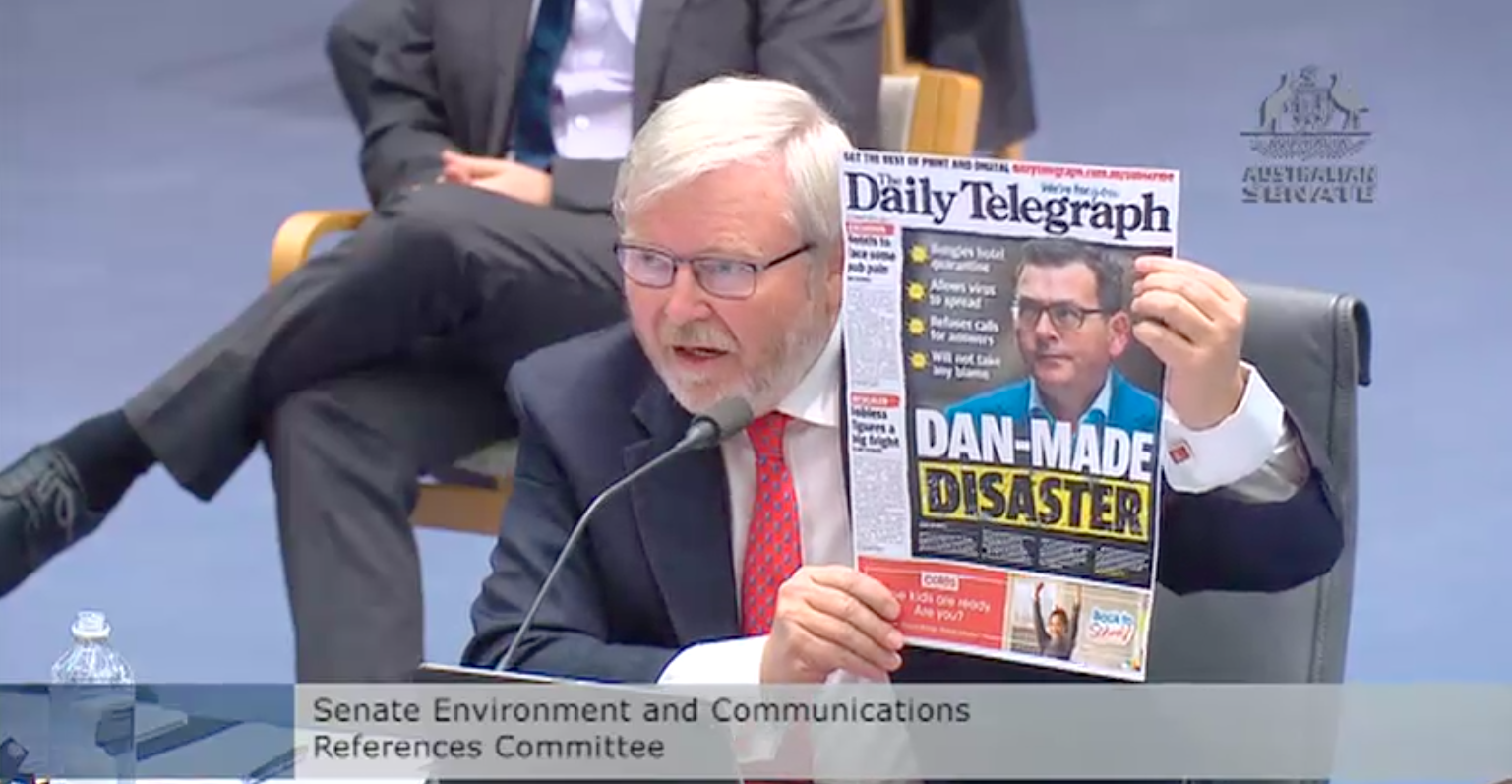 Kevin Rudd appearing at the Senate inquiry into media diversity holding up a cover from the Daily Telegraph, a News Corp publication owned by Rupert Murdoch