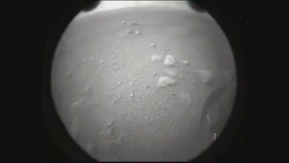 The second image transmitted to Earth after the landing, with the rover's wheel visible at right. (Photo: NASA)