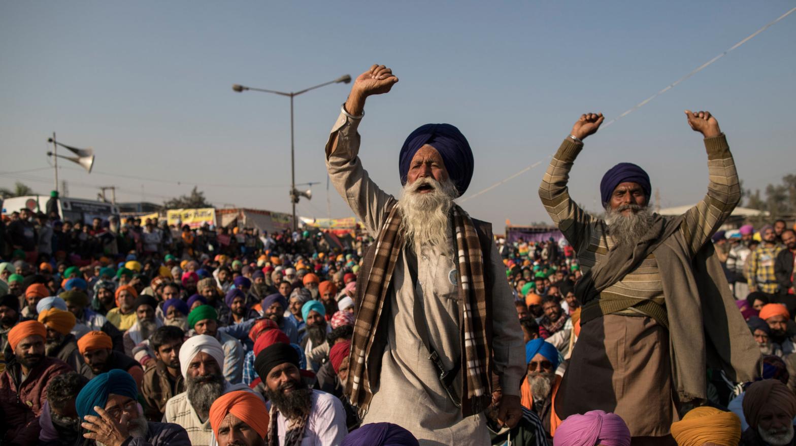 Farmers shout slogans as they participate in a protest at the Delhi Singhu border on December 18, 2020 in Delhi, India. (Photo: Anindito Mukherjee, Getty Images)