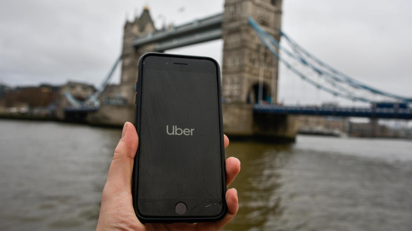 File photo illustration showing the Uber logo on a phone in front of Tower Bridge in London, England.  (Photo: Peter Summers, Getty Images)